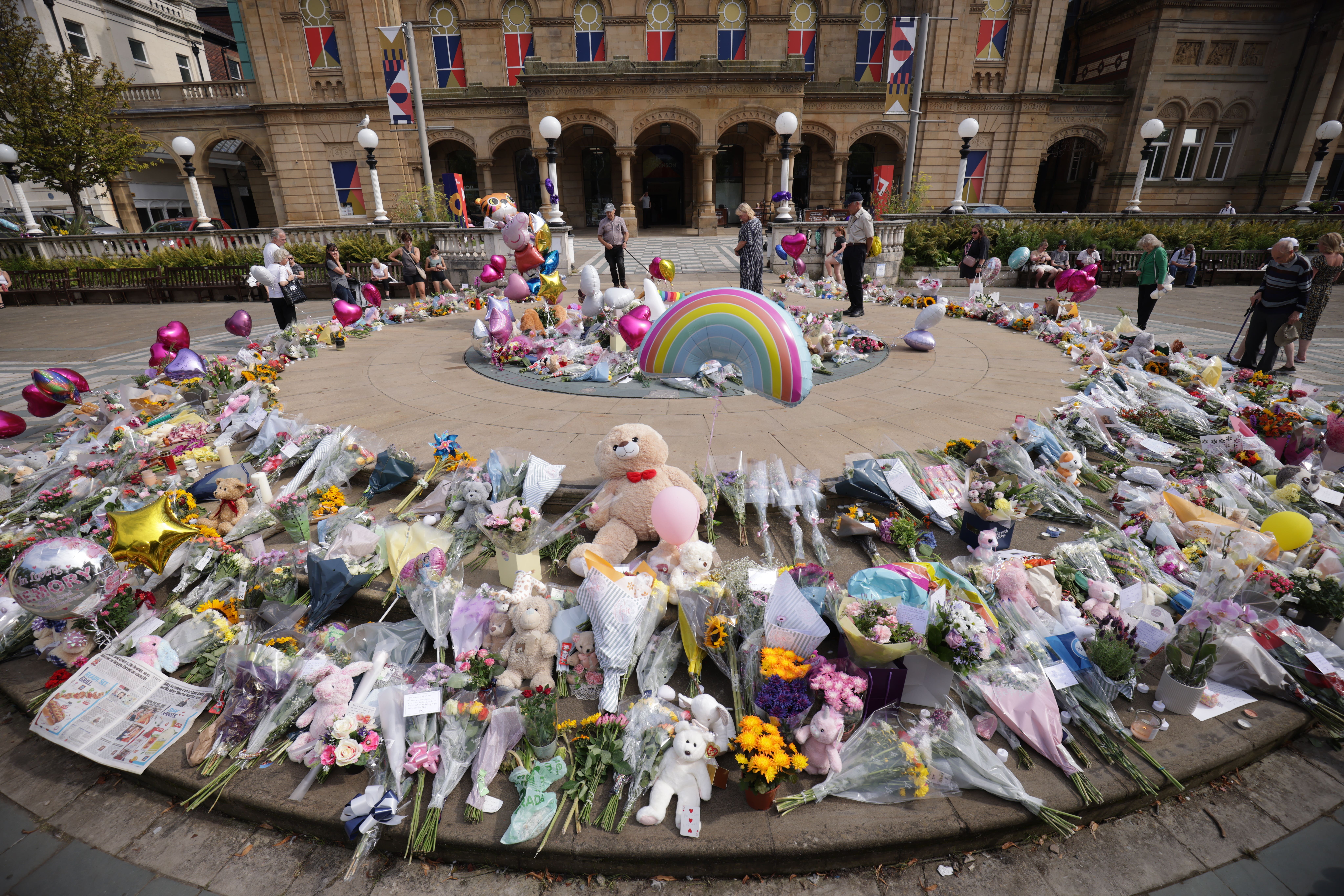 Flowers and tributes outside the Atkinson Art Centre Southport, after three children were fatally stabbed at a Taylor Swift-themed holiday club in Southport last summer (James Speakman/PA)