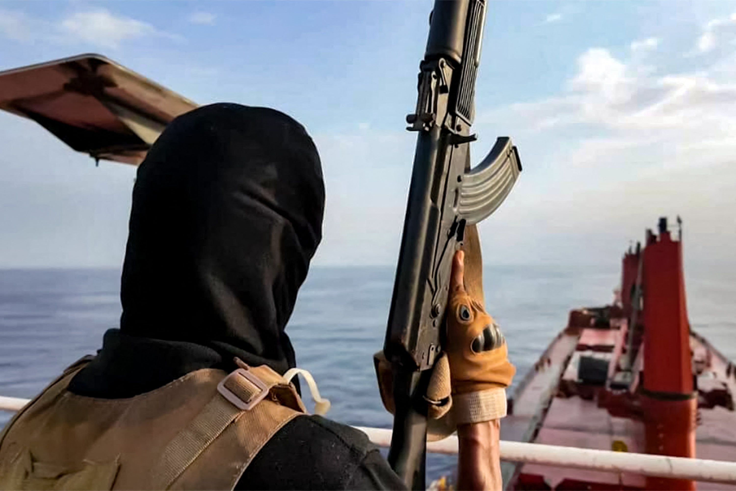 This handout picture released by Yemen's Houthi Ansarullah Media Centre on July 8, 2025 shows Houthi-affiliated fighters carrying out an attack on the Liberia-flagged bulk carrier Magic Seas at sea.