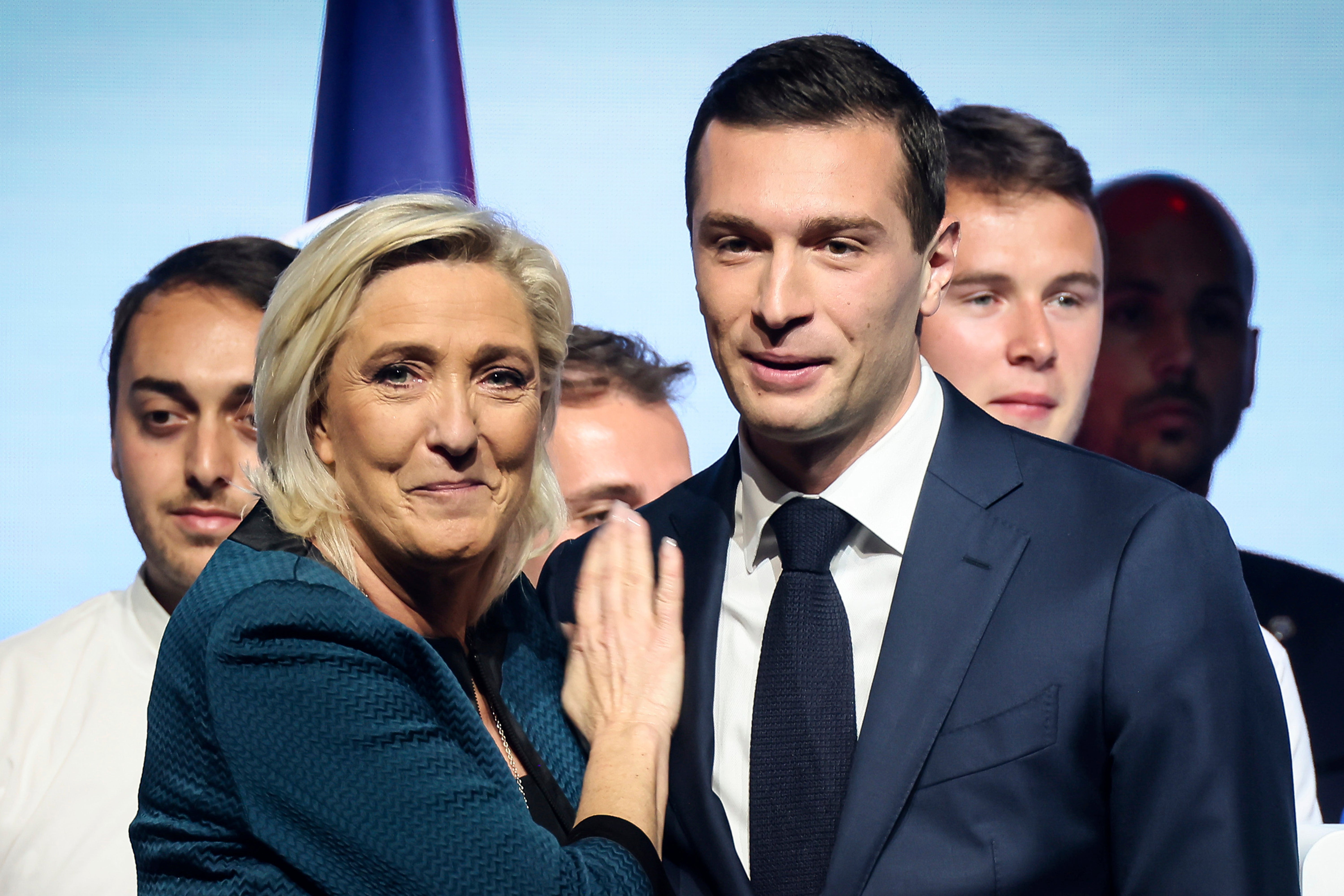 Leader of the French far-right National Rally Marine Le Pen, left, and party president Jordan Bardella, are waiting in the wings