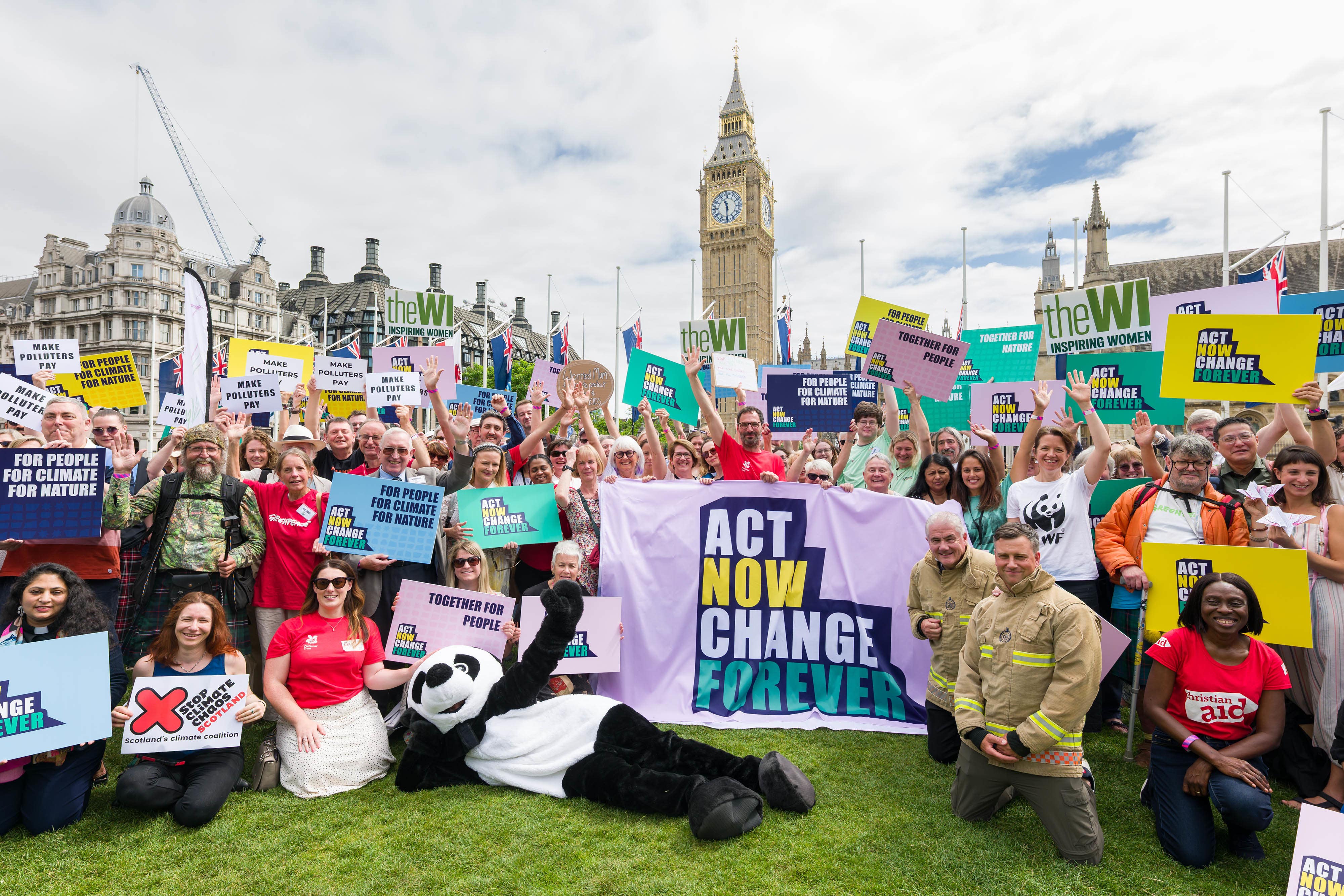 People gather at Parliament Square in London for the Act Now Change Forever Mass Lobby (Richard Dawson/ PA Assignments)