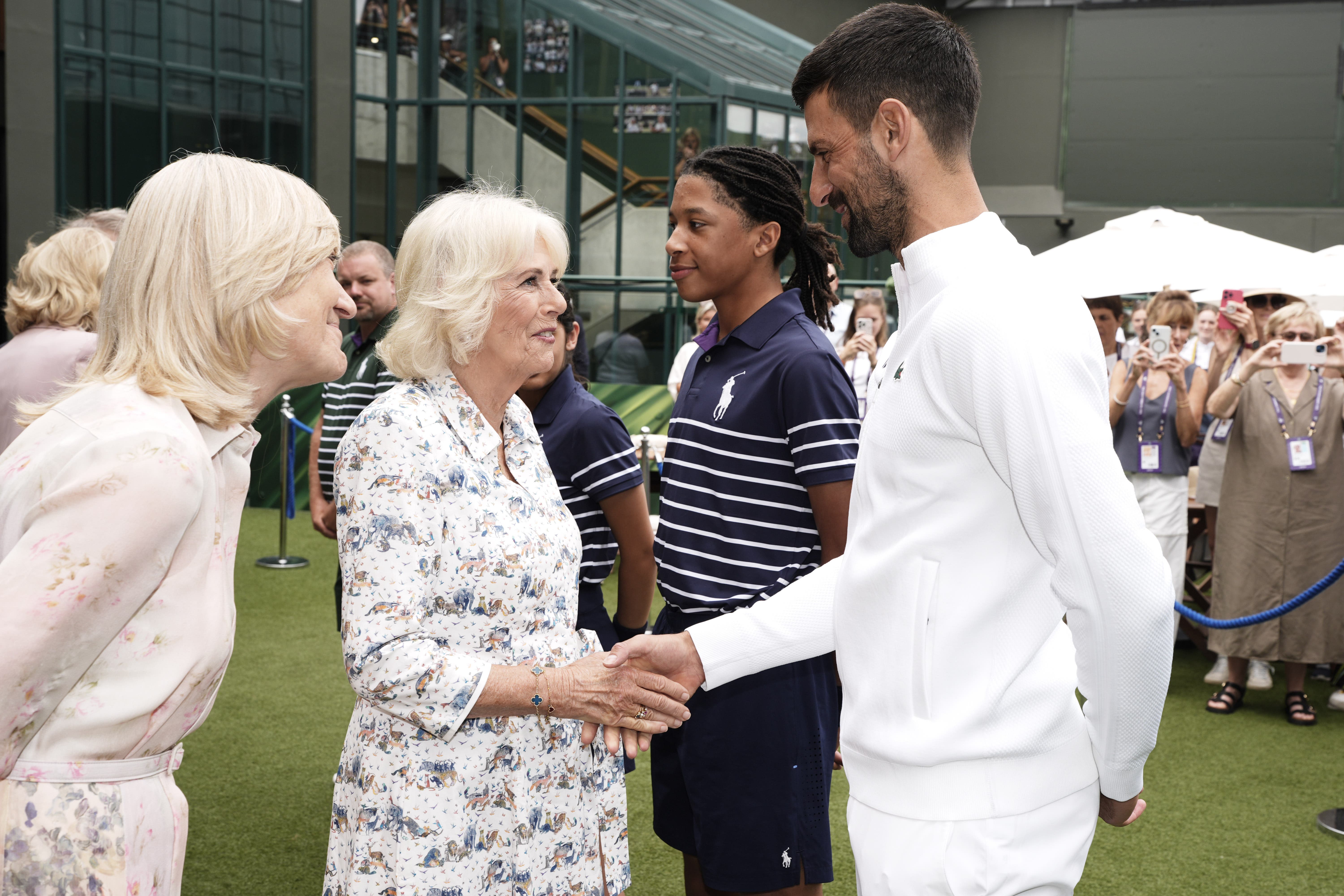 The Queen speaks to Novak Djokovic at the All England Lawn Tennis and Croquet Club on day 10 of the 2025 Wimbledon Championships (Jordan Pettitt/PA)