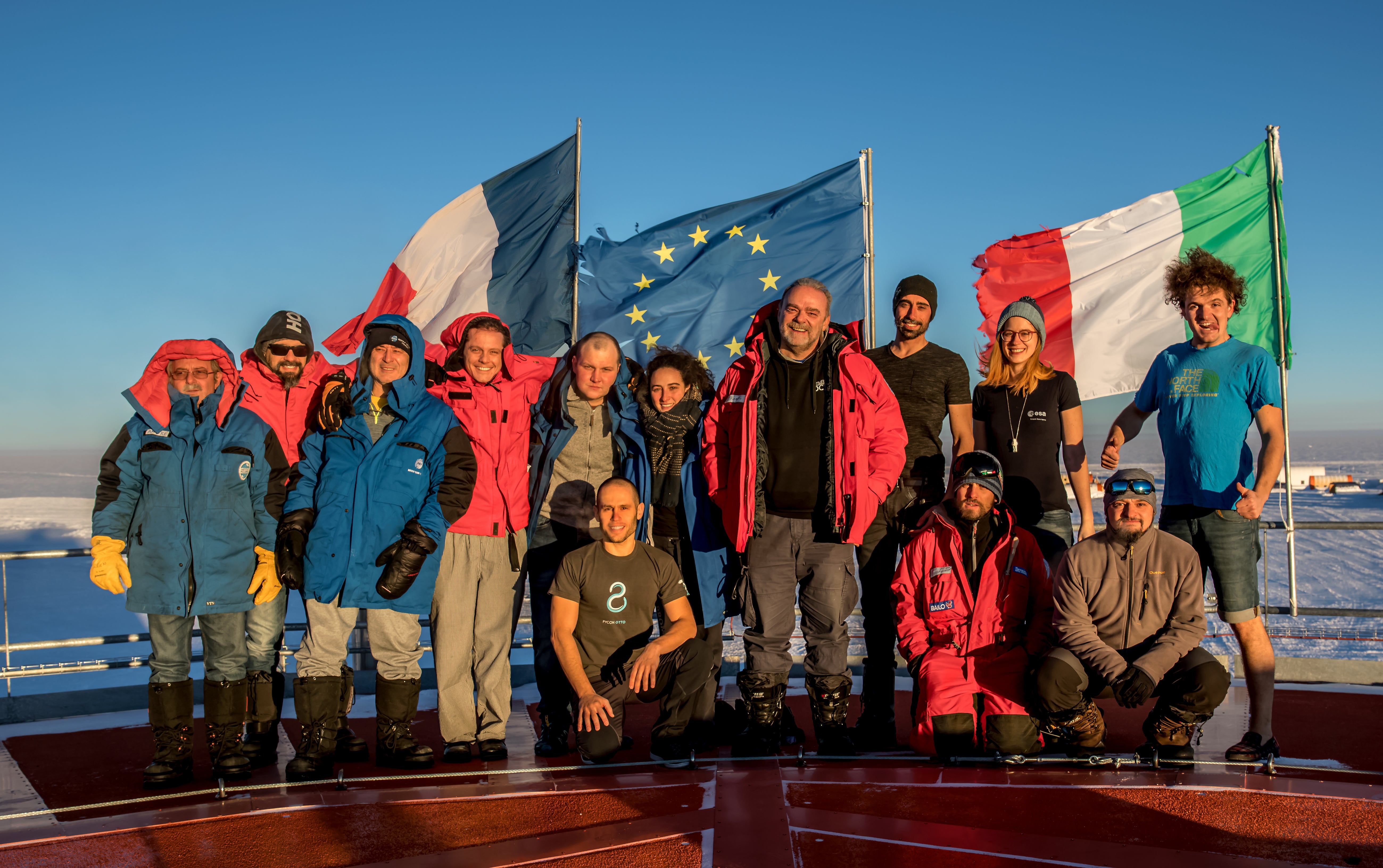 The summer team for the French-Italian Antarctic base stands outside. The contrast in temperature, weather, light and environment is evident when contrasted with the picture below, taken a few months later by the winter team