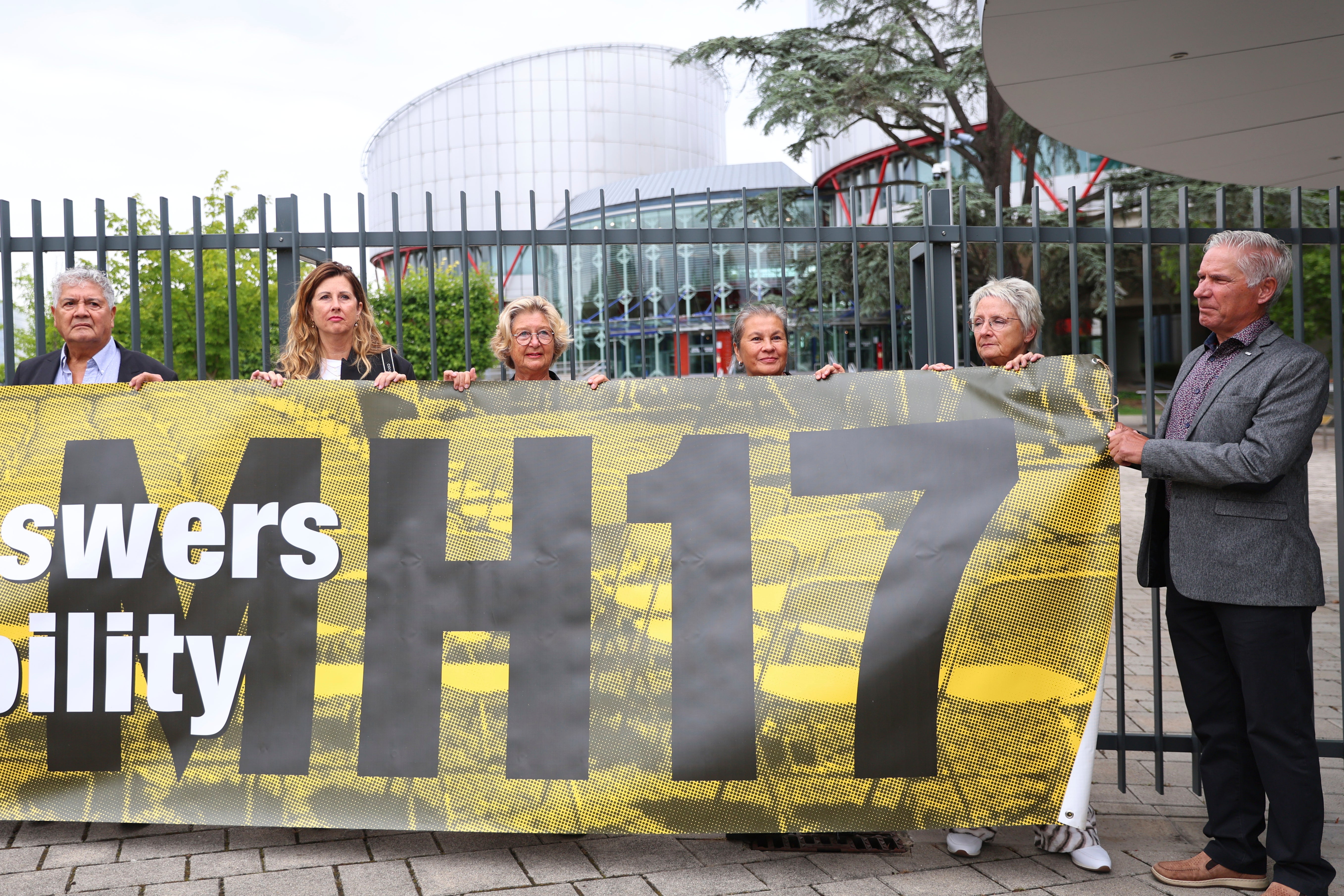 People demonstrate outside the European Court of Human Rights before it issues a landmark set of rulings about alleged Russian violations in Ukraine since 2014.