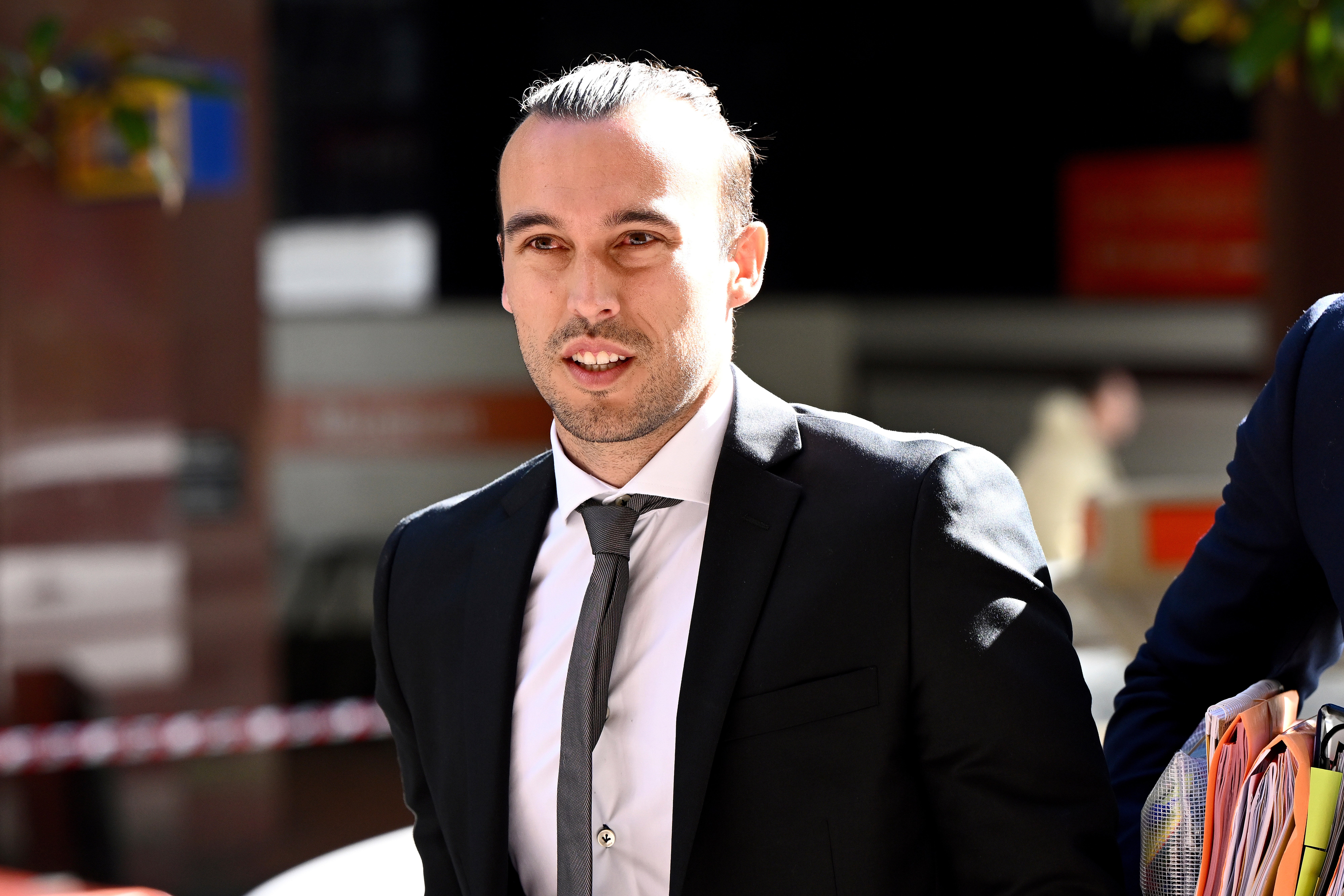 Clayton Lewis arriving at court