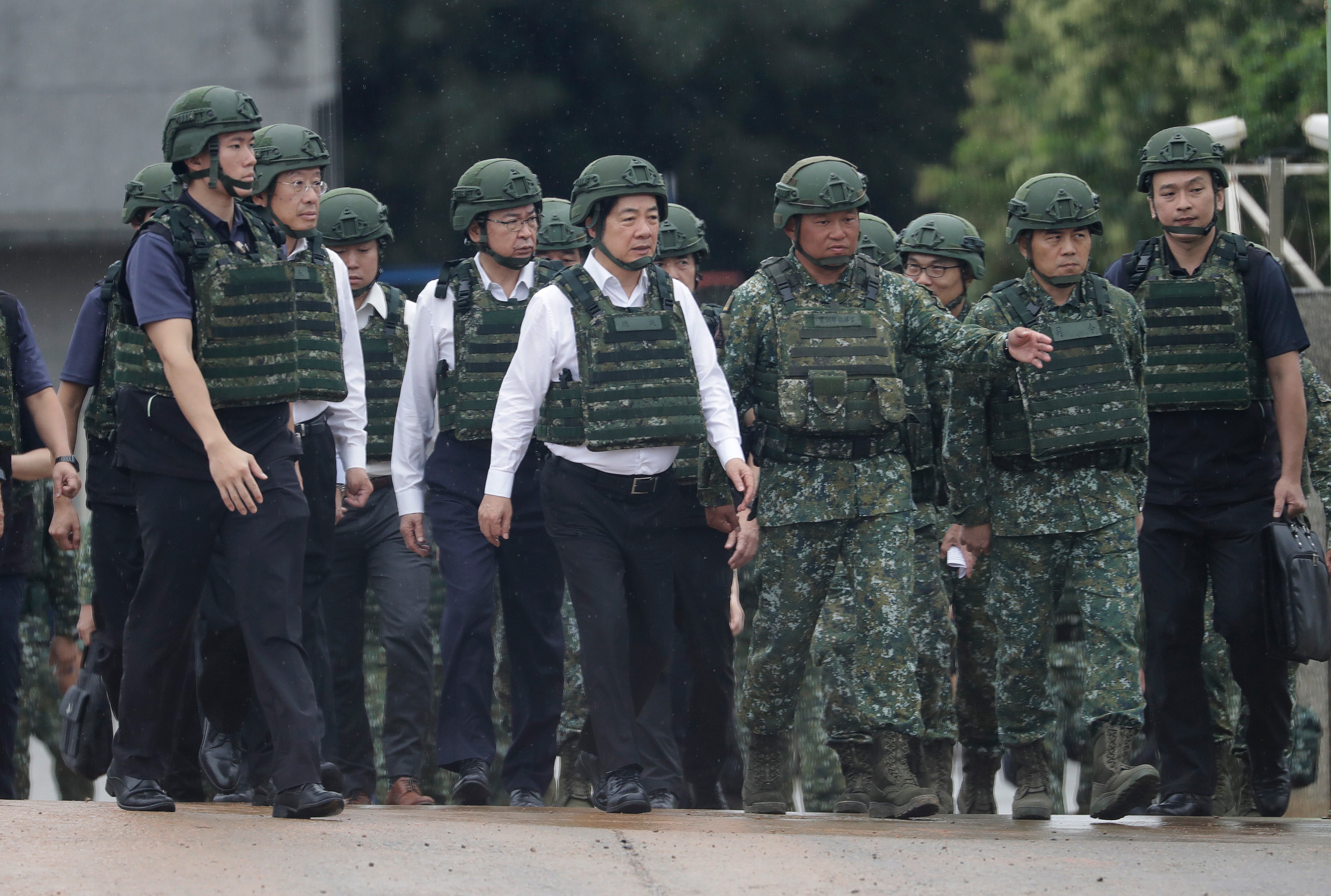 Taiwan President Lai Ching-te, center, inspects a live-fire shooting training in Hsinchu County, Taiwan, Thursday, 10 July