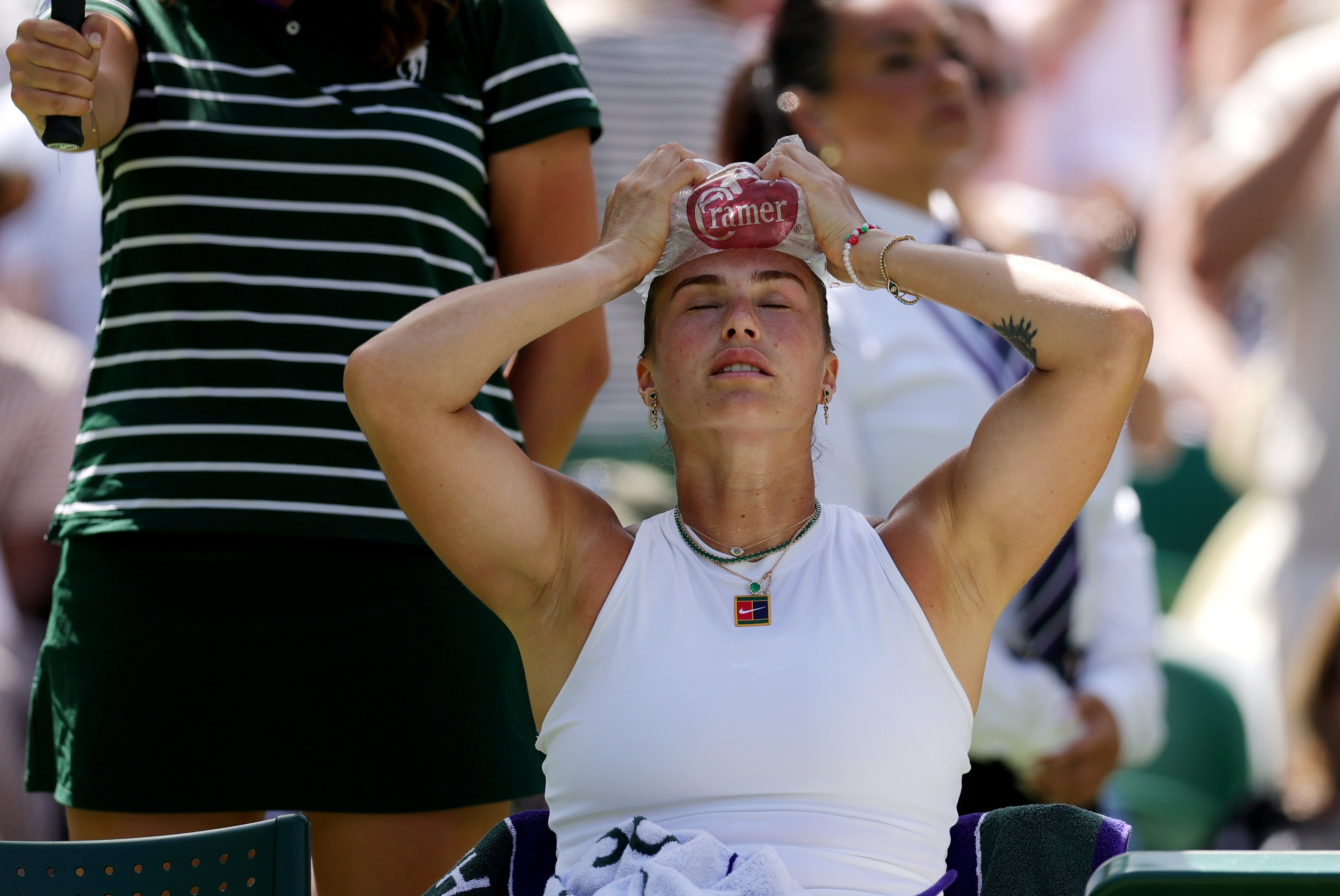 Aryna Sabalenka holds ice on her head amid her semi-final against Amanda Anisimova