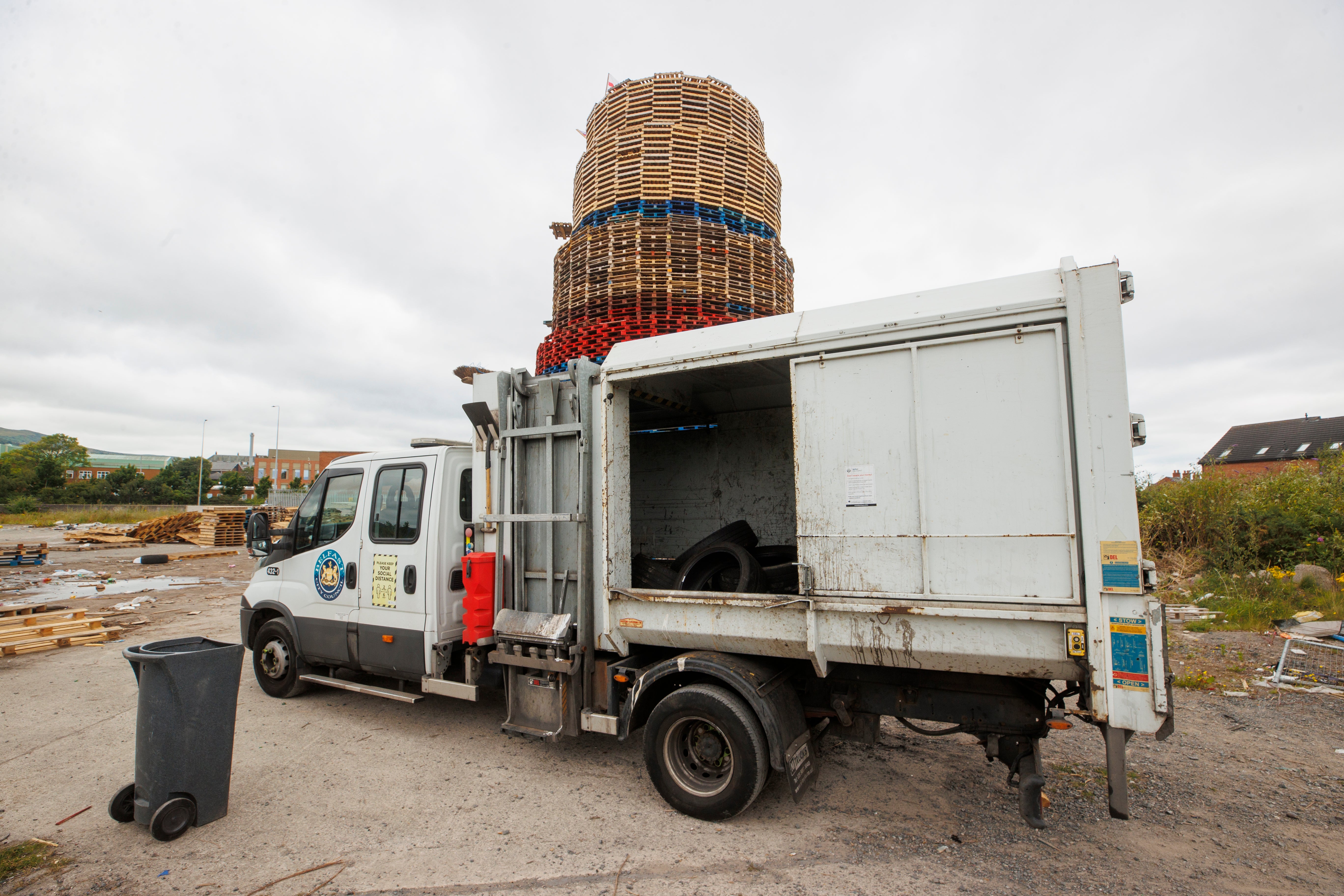 Belfast City Council removes tyres located close to the bonfire on Broadway Industrial Estate off Donegal Road in south Belfast