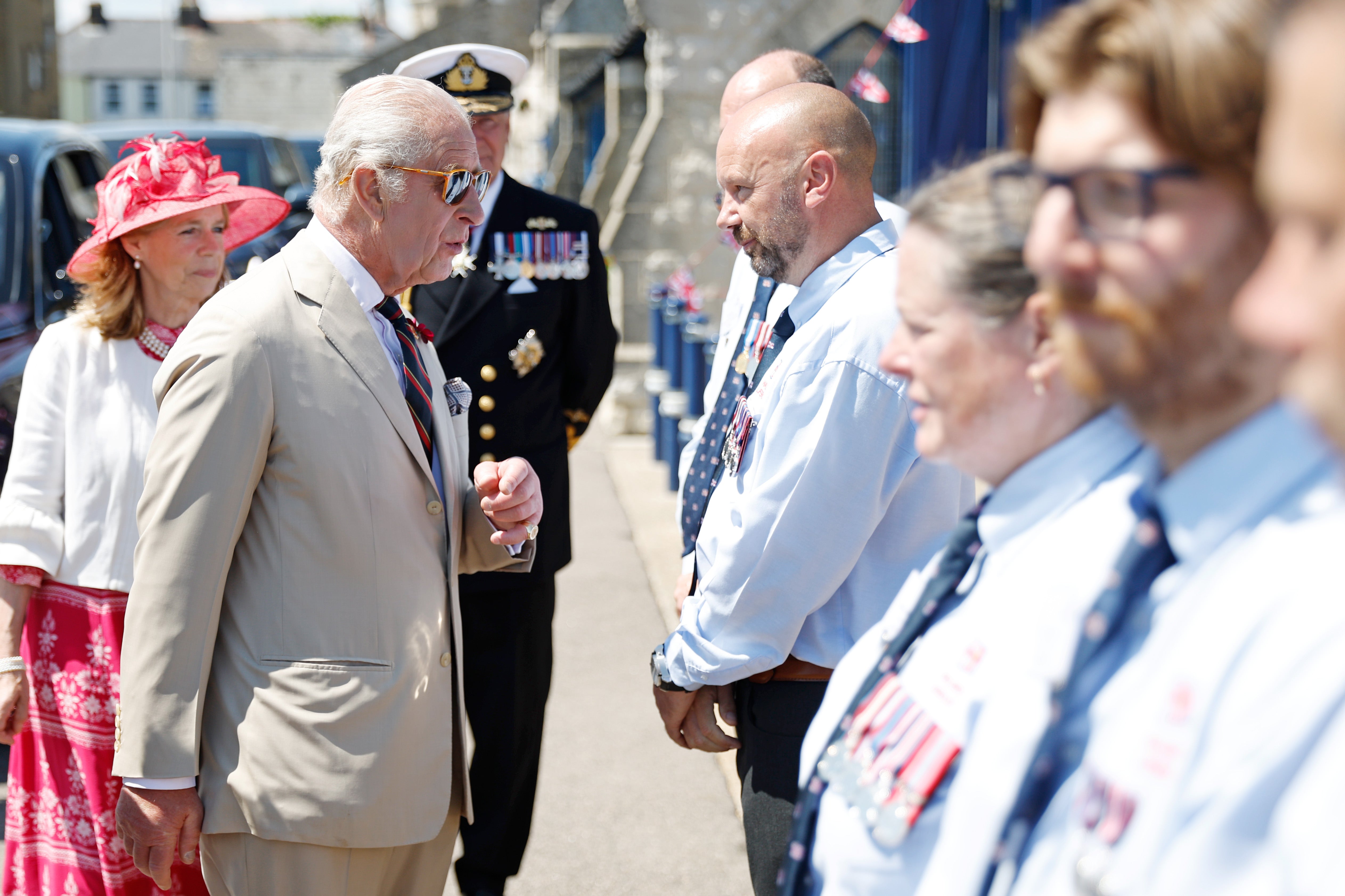 The King heard from RNLI volunteers about a rescue operation in which a small boat began taking on water