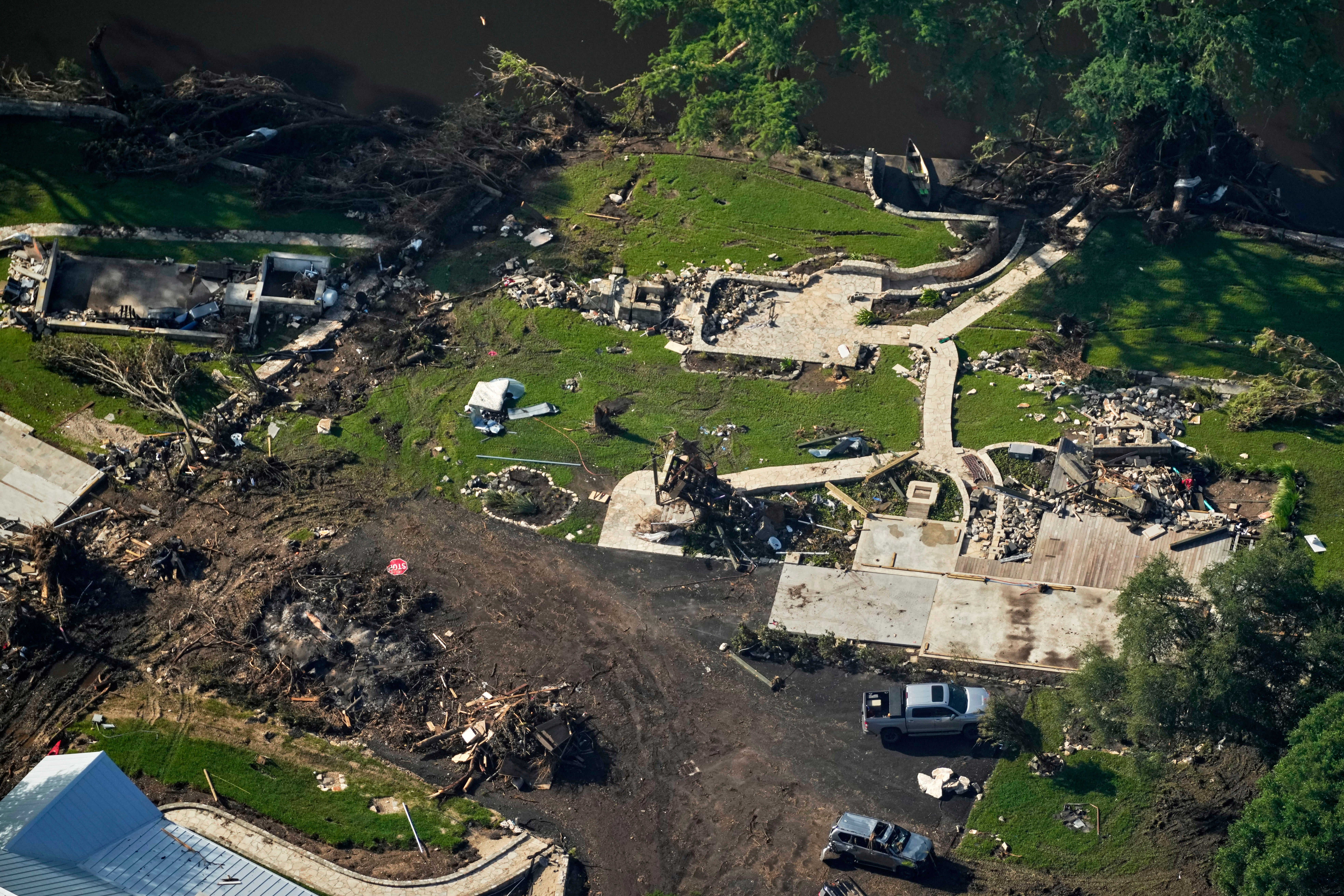 The ruins of a building pictured in Hunt, Texas after Friday's devastating floods. Rescue crews say they're navigating 'mounds' of debris as they search for people