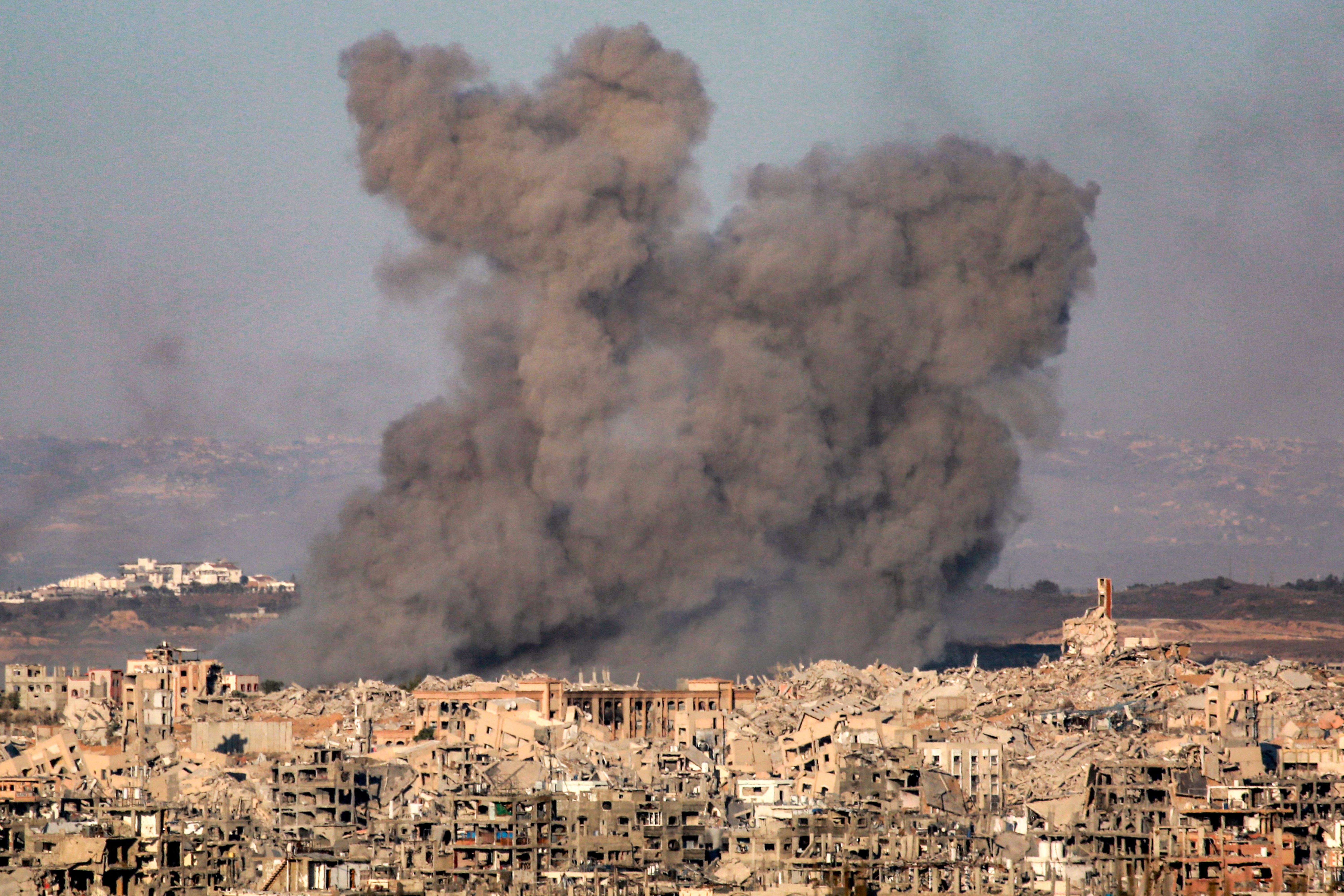 Smoke plumes rise after Israeli bombardment of Beit Lahia, Gaza, on 9 July 2025