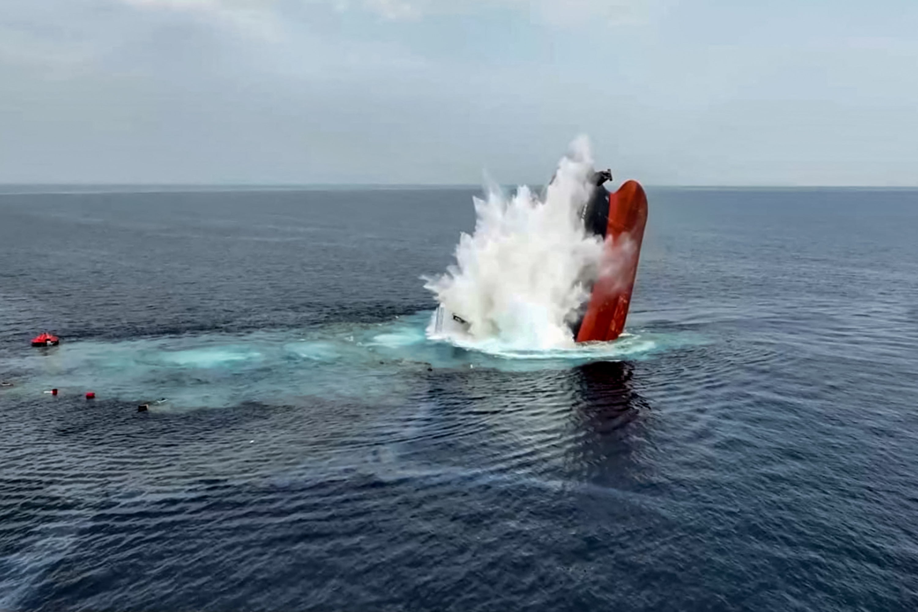 This handout picture released by Yemen’s Houthi group reportedly shows the Liberia-flagged bulk carrier Eternity C sinking after it was attacked