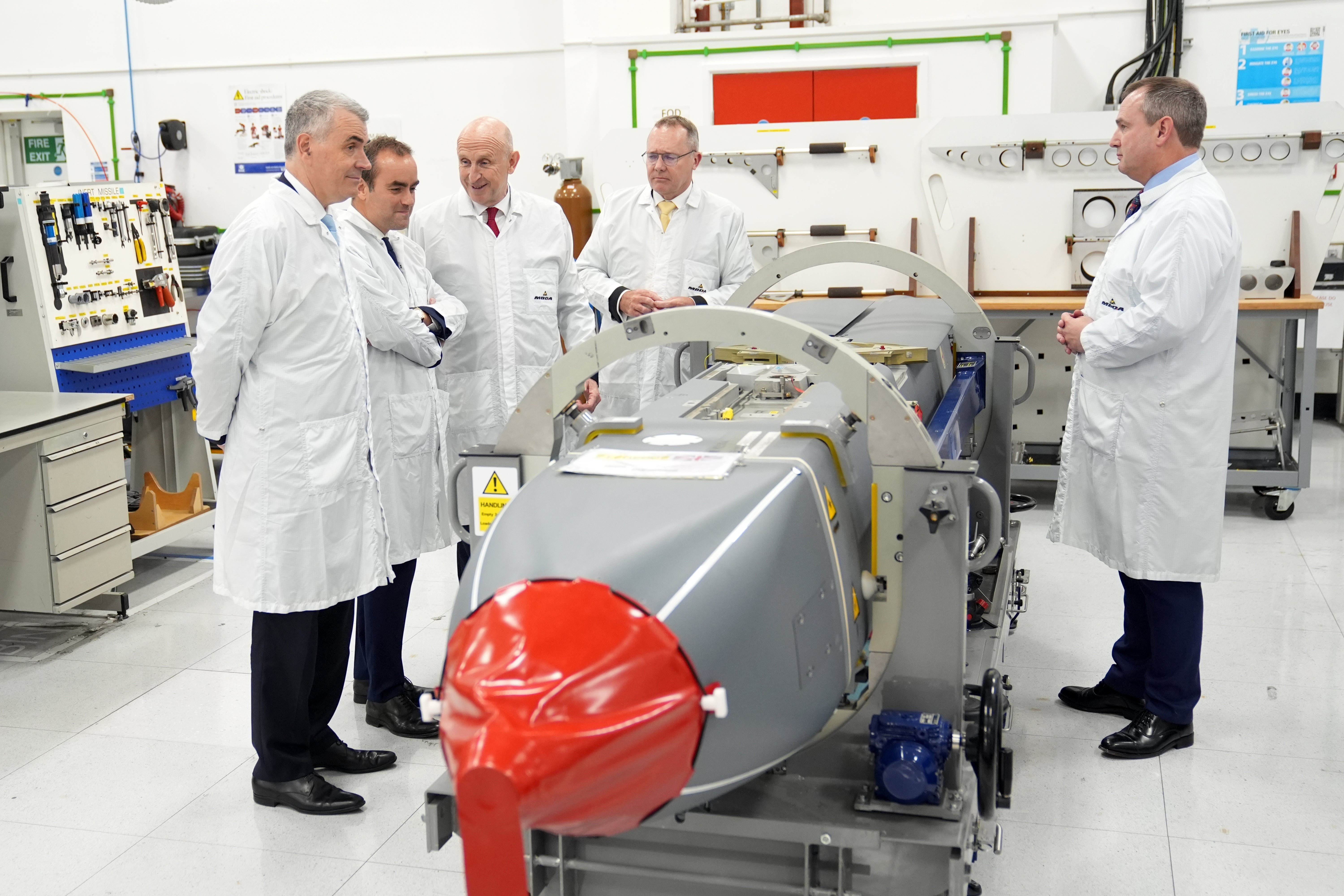 Defence Secretary John Healey (third left) and his French counterpart Sebastien Lecornu (second left), are accompanied by French Managing Director of MBDA, Stephane Reb (left) and Managing Director of MBDA UK, Chris Allam (second right), as they view a long-range air-launched Storm Shadow cruise missile, during a visit to MDBA in Hertfordshire. Picture date: Wednesday 9 July 2025. PA Photo