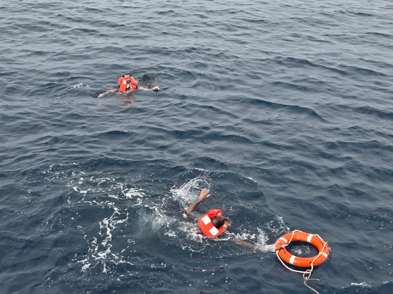 Crew members said to be from cargo ship Eternity C, which sank after being attacked, are seen at sea during a rescue operation on Wednesday, off Yemen