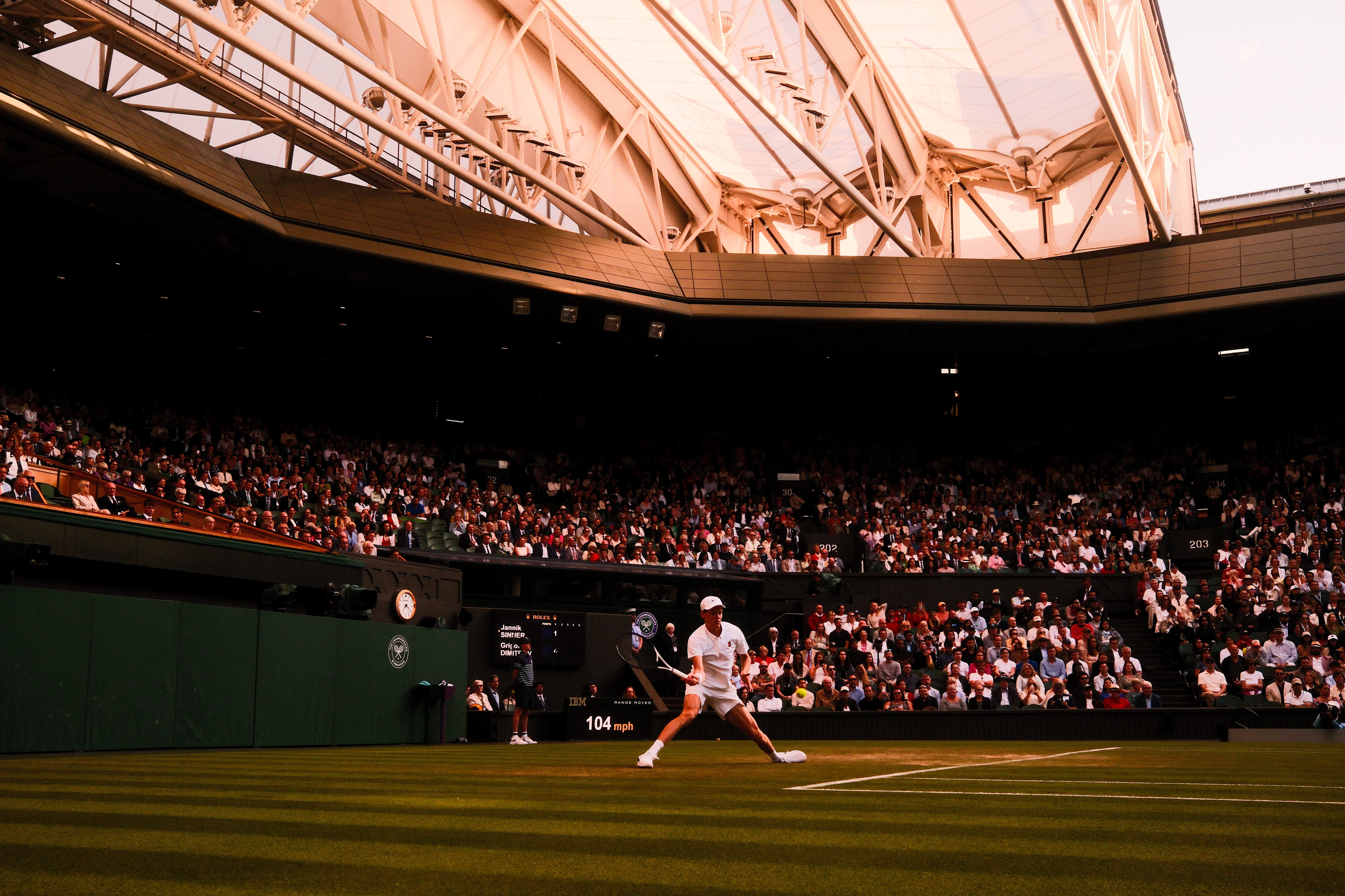 Jannik Sinner returns a ball on Centre Court (Jordan Pettitt/PA)