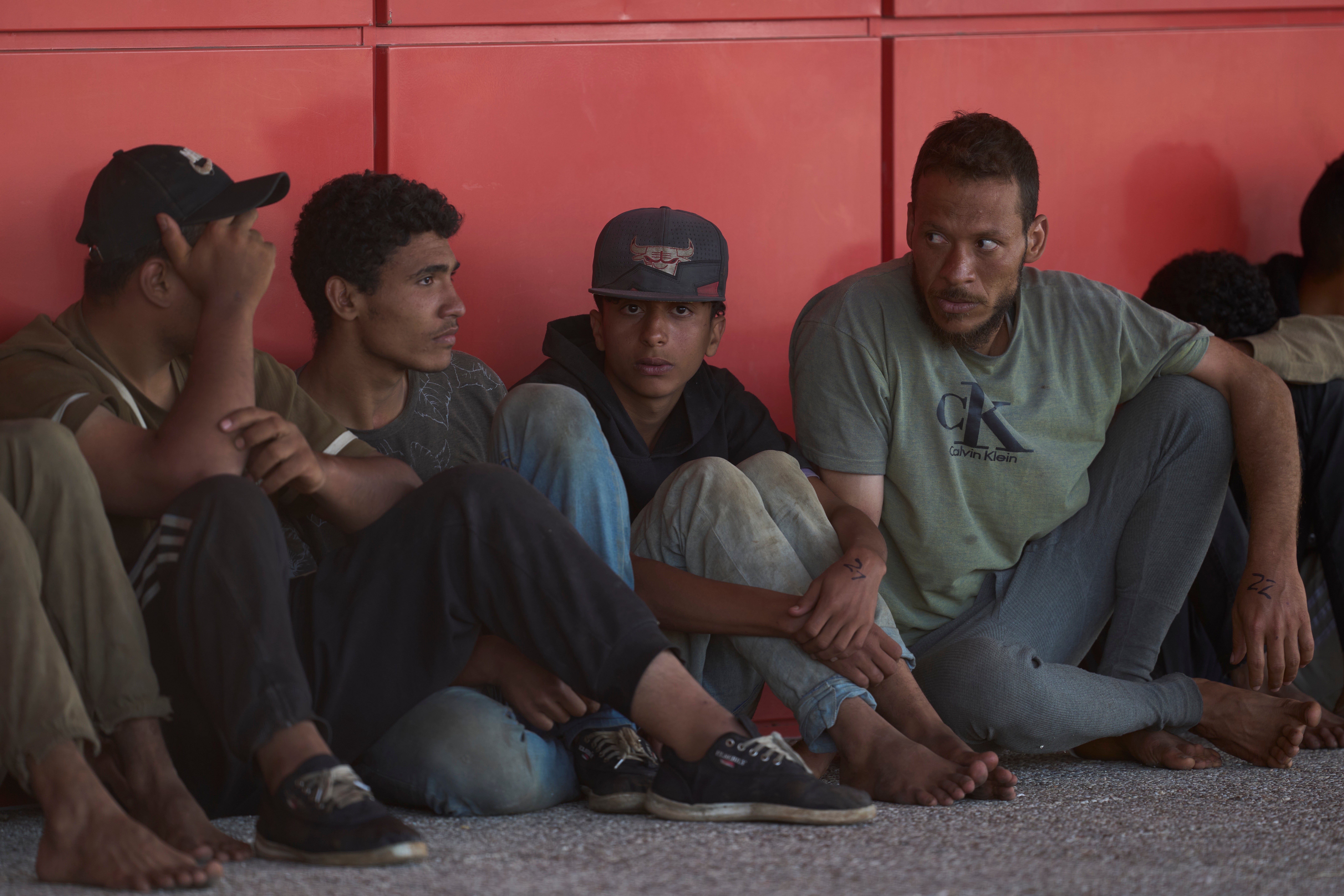 Migrants from north Africa await in Crete to be registered – but a law passed in July means anyone entering Greece illegally can no longer apply for asylum