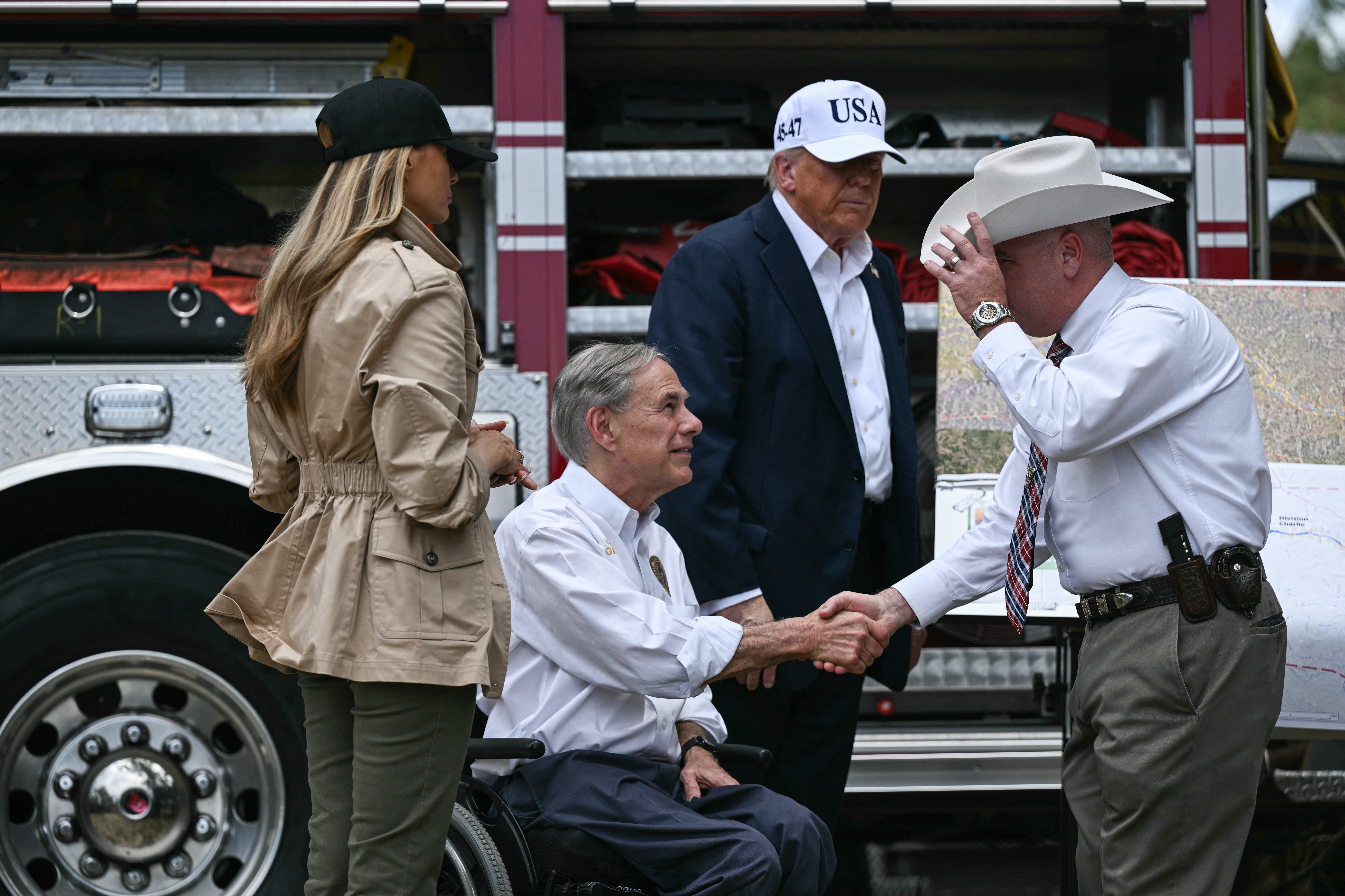 President Donald Trump, First Lady Melania Trump and Texas Governor Greg Abbott meet with local officials and first responders in Kerrville, Texas on Friday