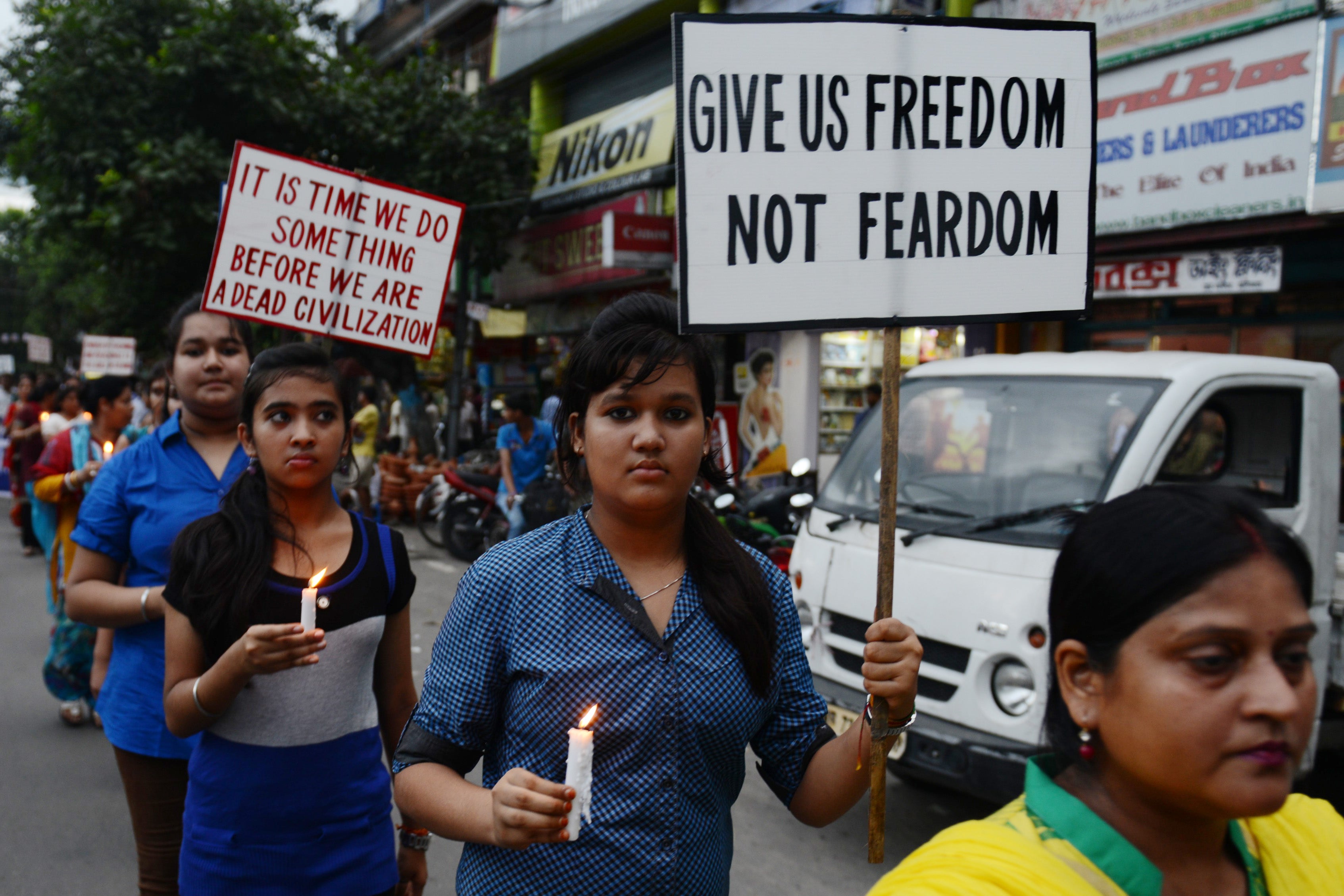 Indian activists hold placards demanding safety for women