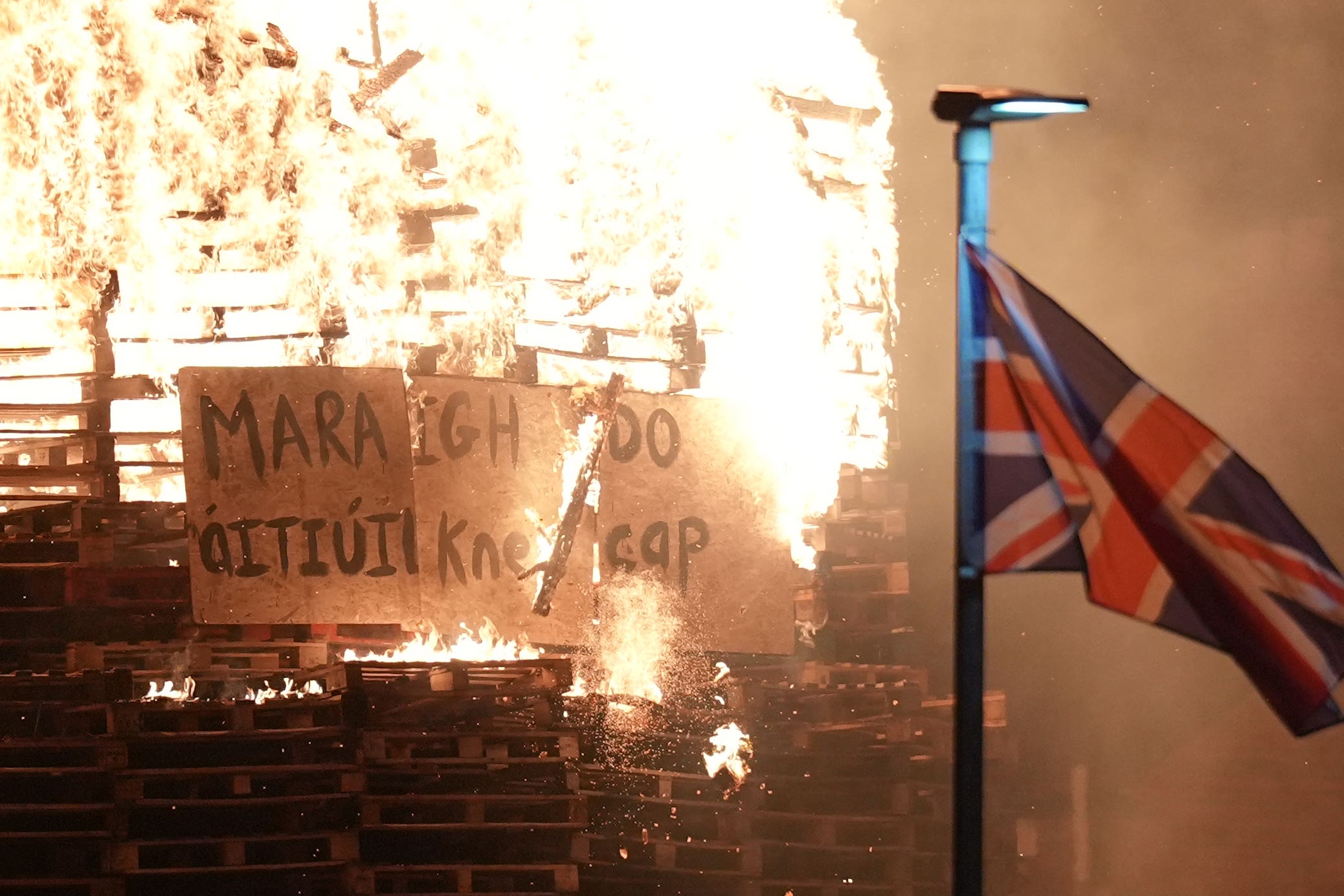 Kneecap Graffiti is burned on a Bonfire at Roden Street in Belfast (Niall Carson/PA)