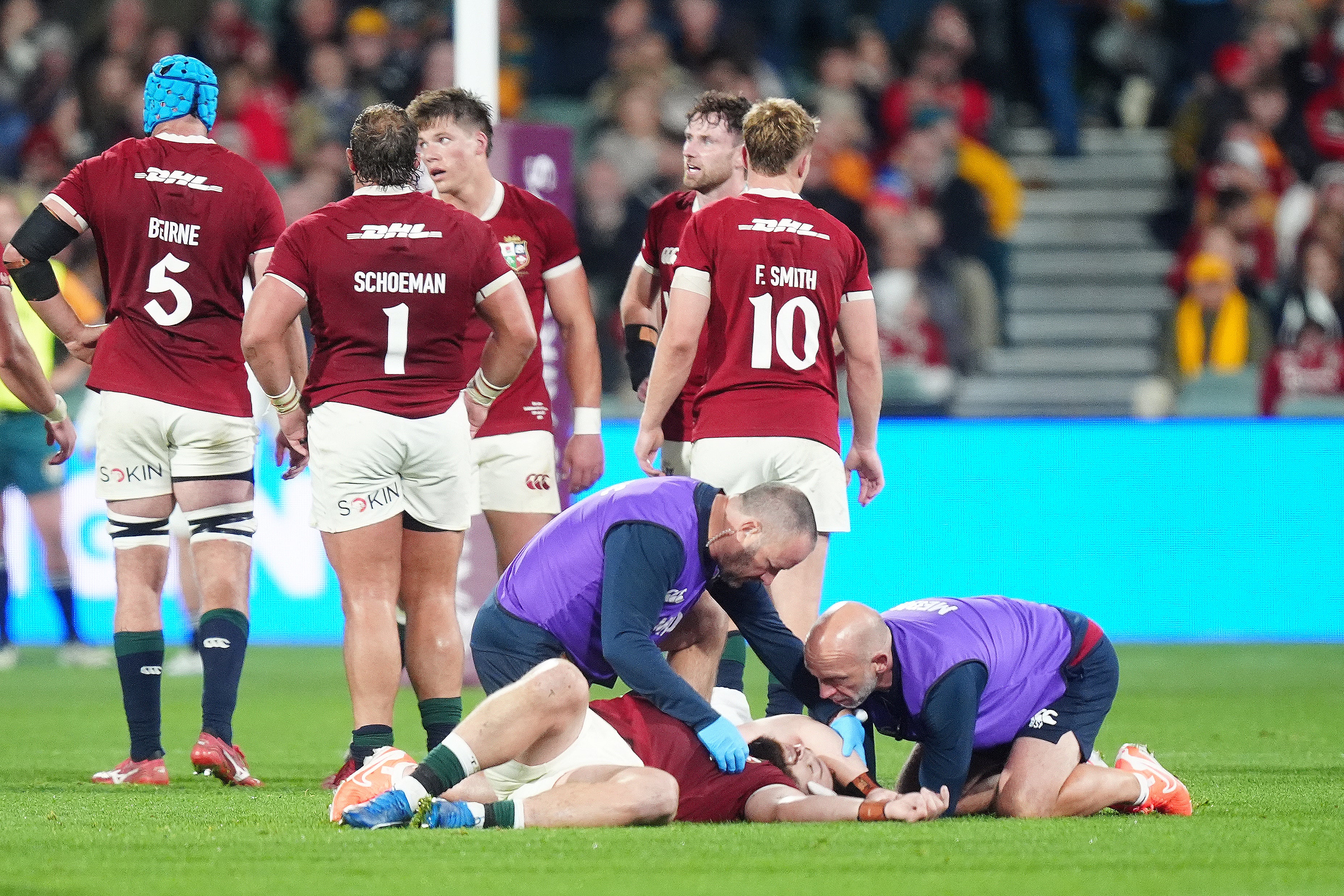 British and Irish Lions' Luke Cowan-Dickie is treated by medical staff after going down with a head injury