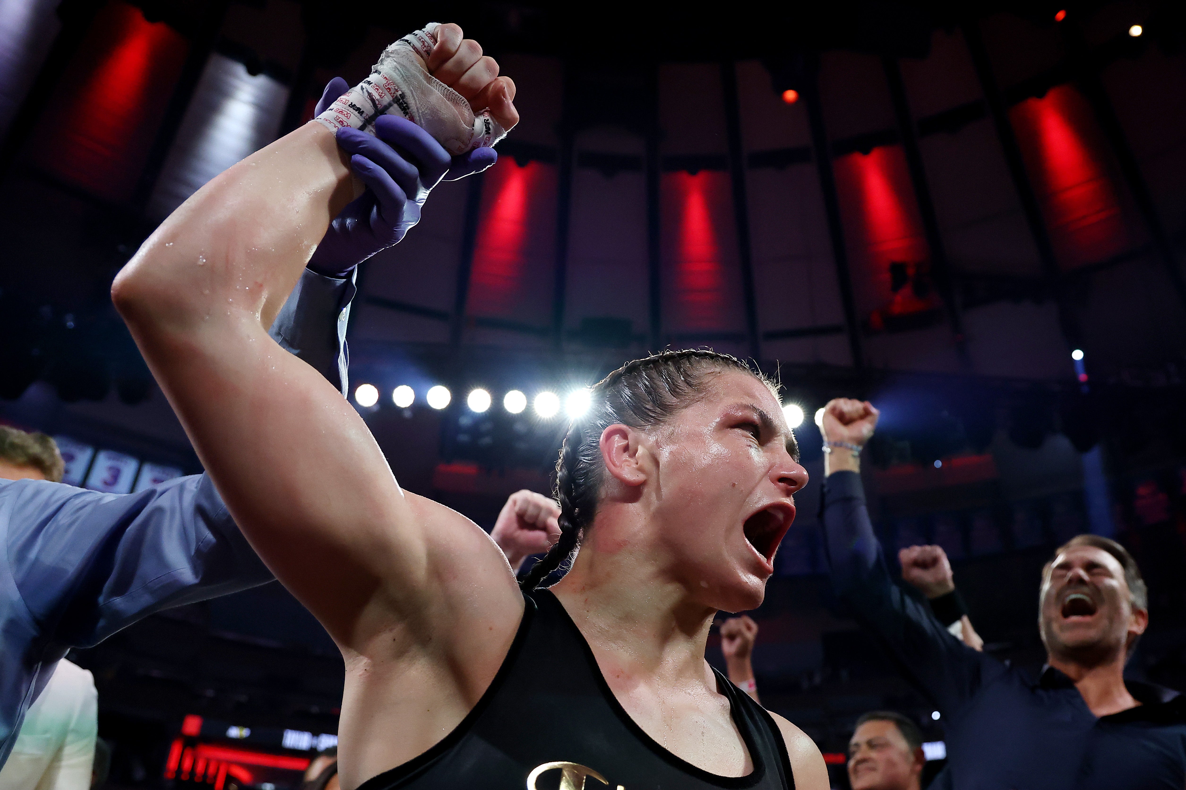 Katie Taylor celebrates after defeating Amanda Serrano by a majority decision