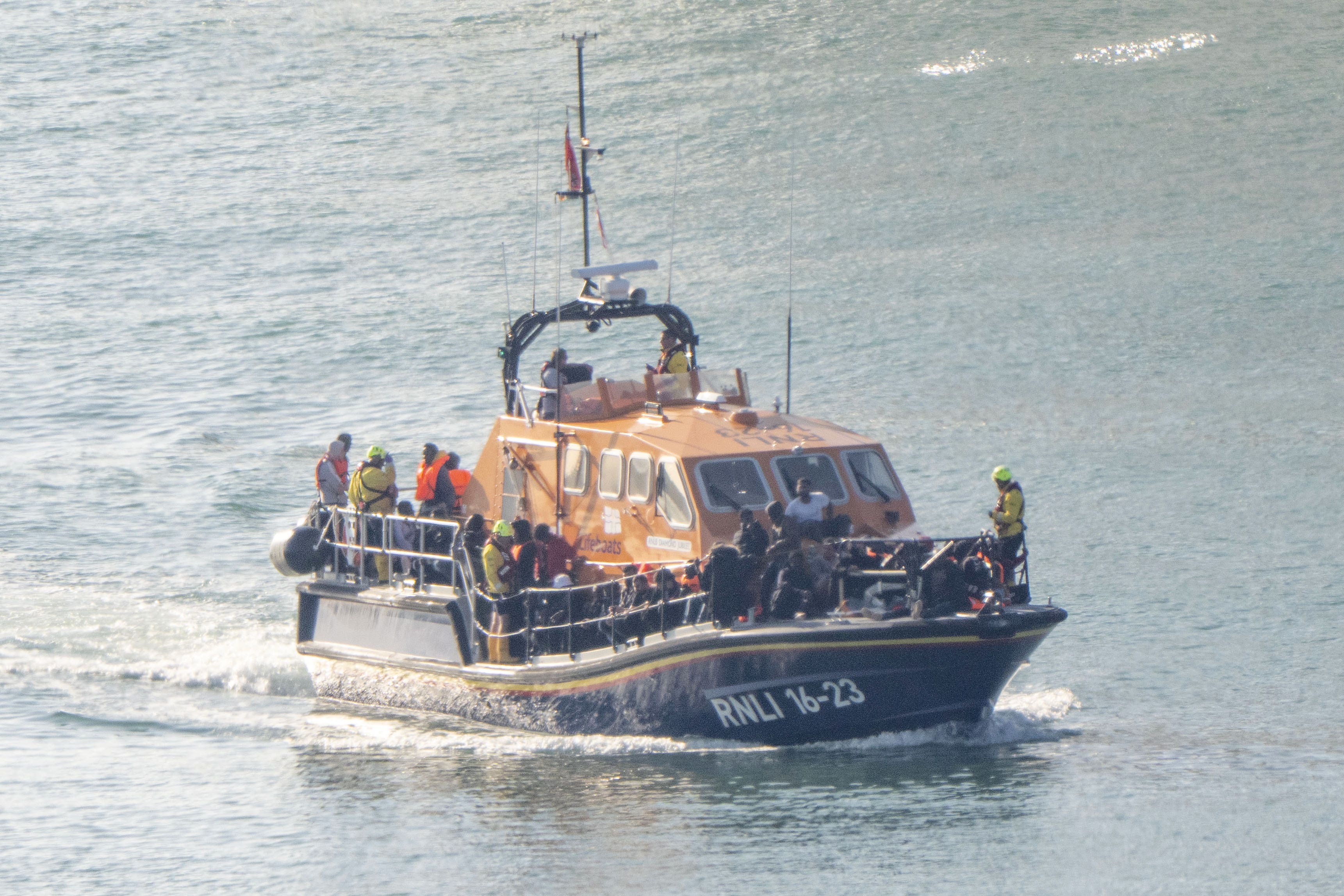 A group of people thought to be migrants are brought in to Dover, Kent, onboard an RNLI Lifeboat following a small boat incident in the Channel (Gareth Fuller/PA)