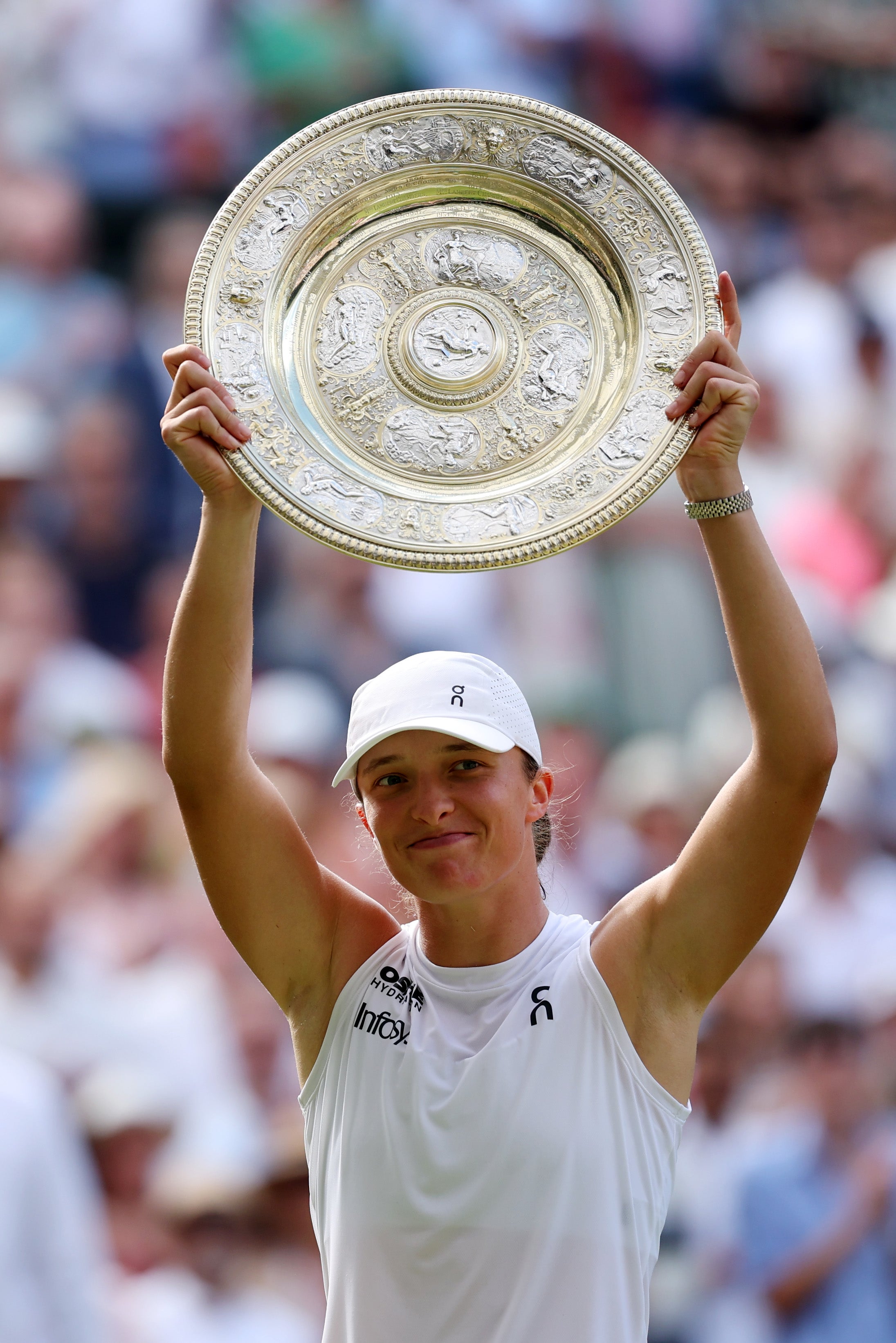 Iga Swiatek of Poland lifts the trophy