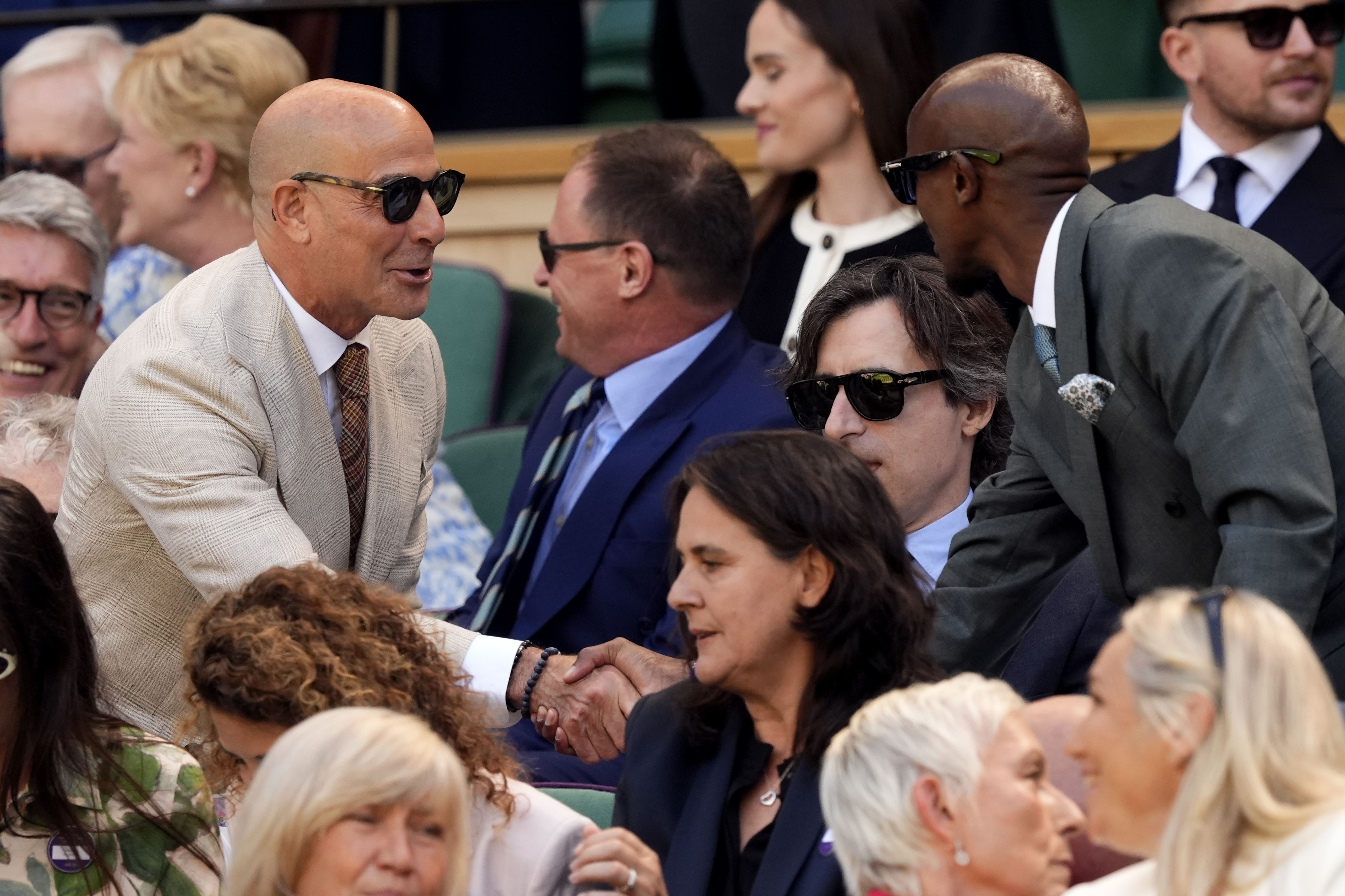 Stanley Tucci with Sir Mo Farah in the Royal Box on day thirteen of the 2025 Wimbledon Championships at the All England Lawn Tennis and Croquet Club, London (Jordan Pettitt/PA)