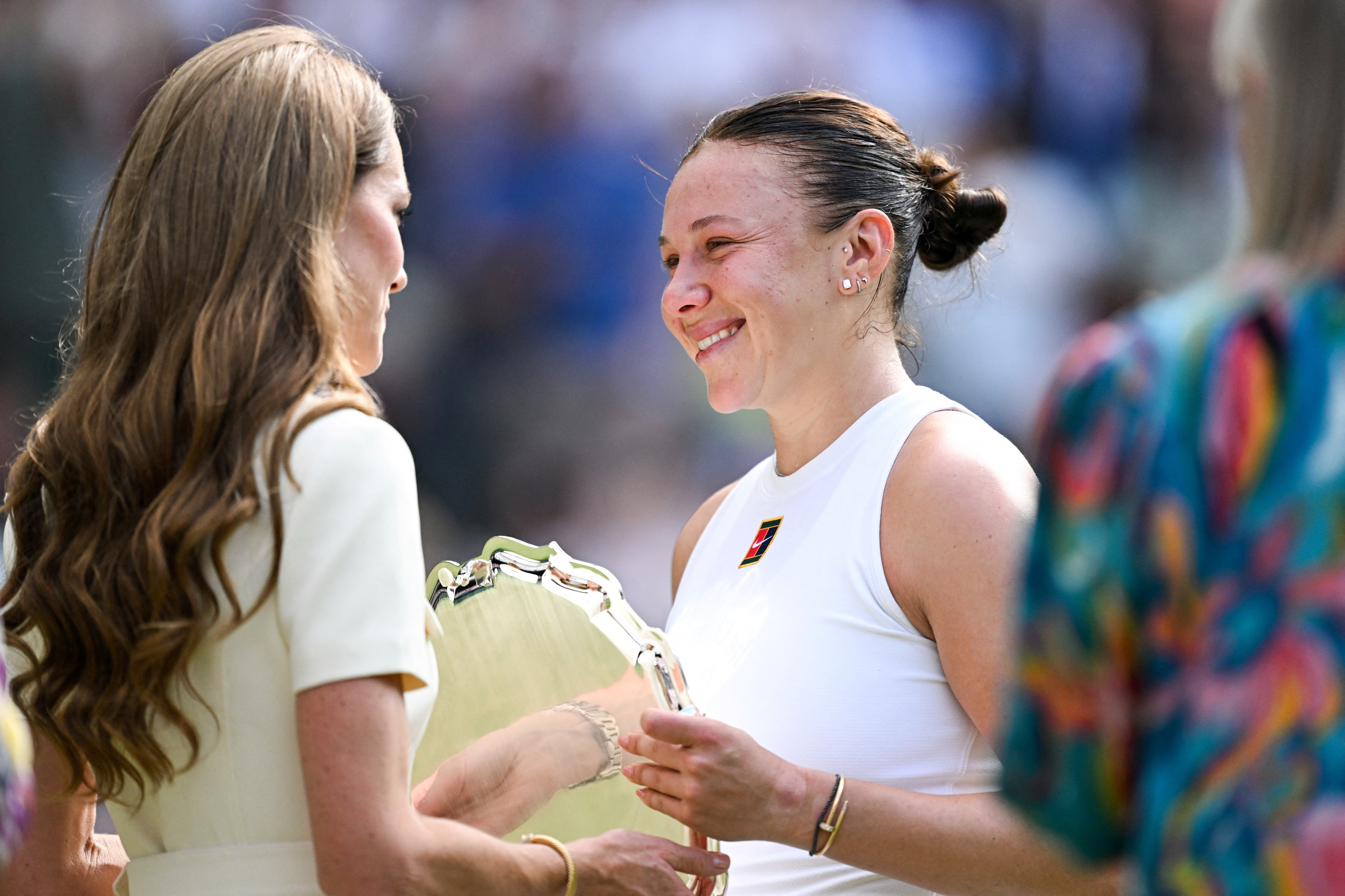 Catherine, Princess of Wales consoles Amanda Anisimova after the final