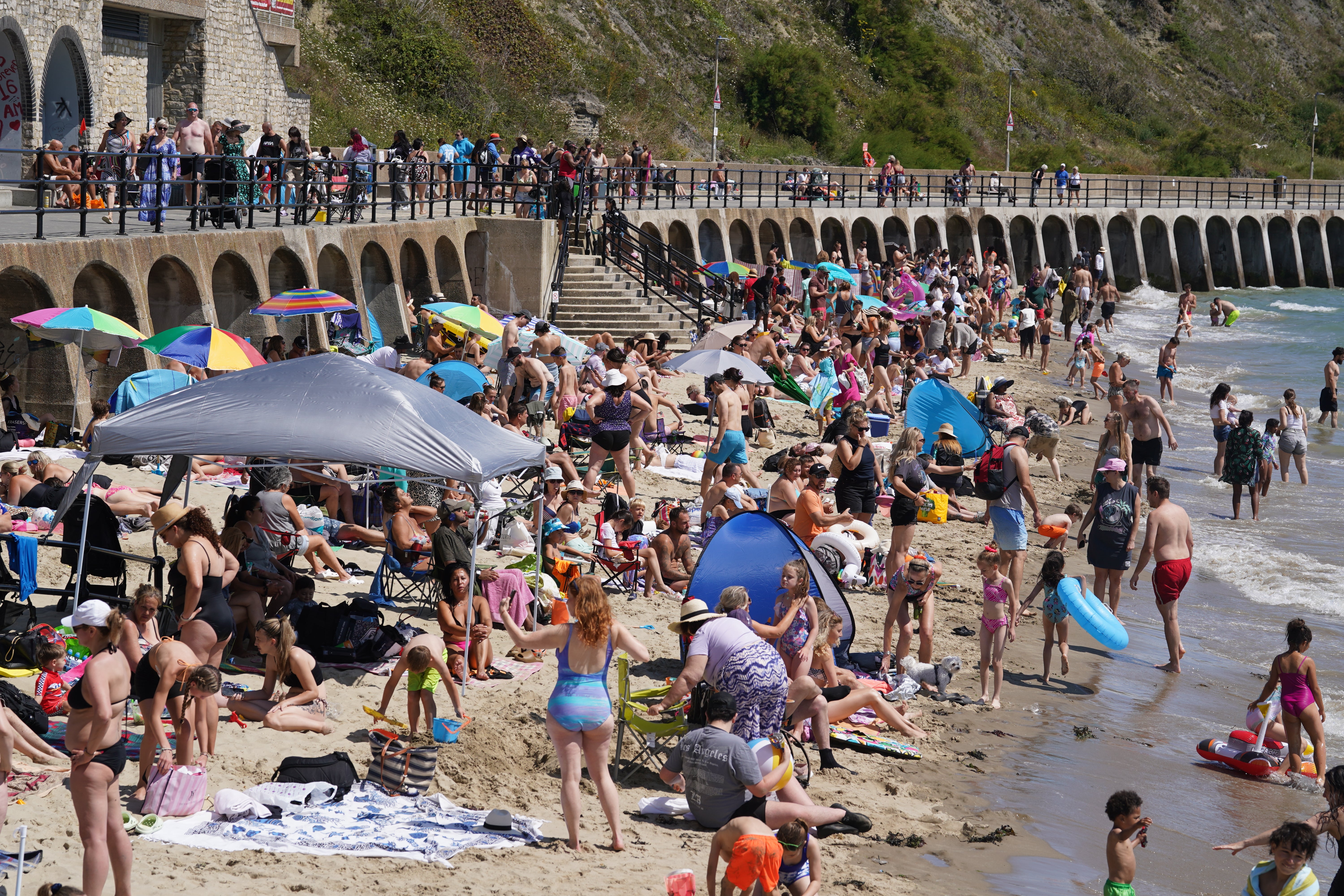 People enjoying the hot weather on Sunny Sands beach in Folkestone on Saturday