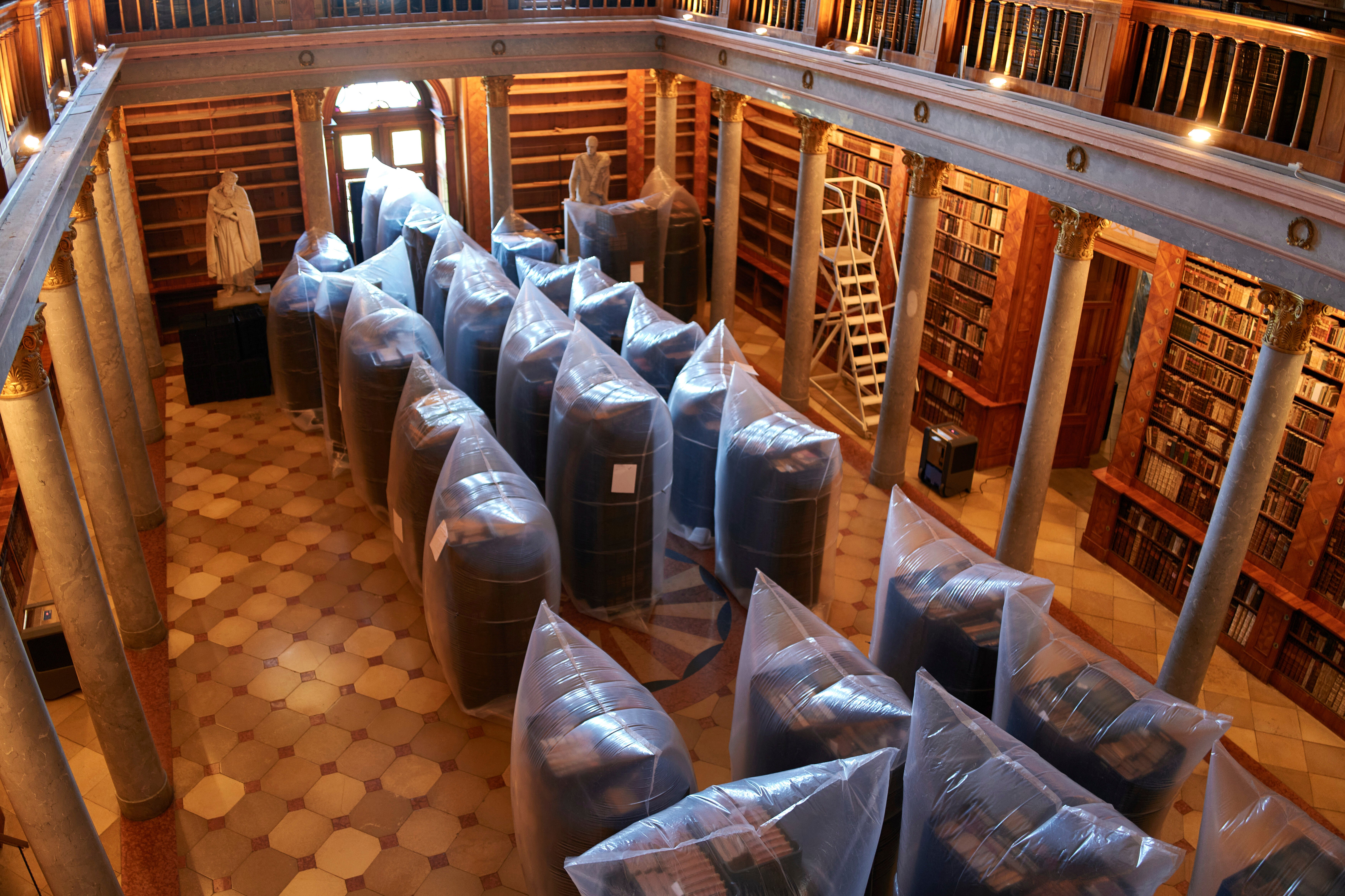 Books are kept in sealed sacks for disinfection