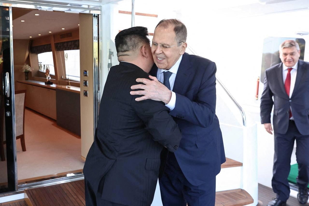 North Korean leader Kim Jong Un greets Russian foreign minister Sergei Lavrov during a meeting in Wonsan, North Korea