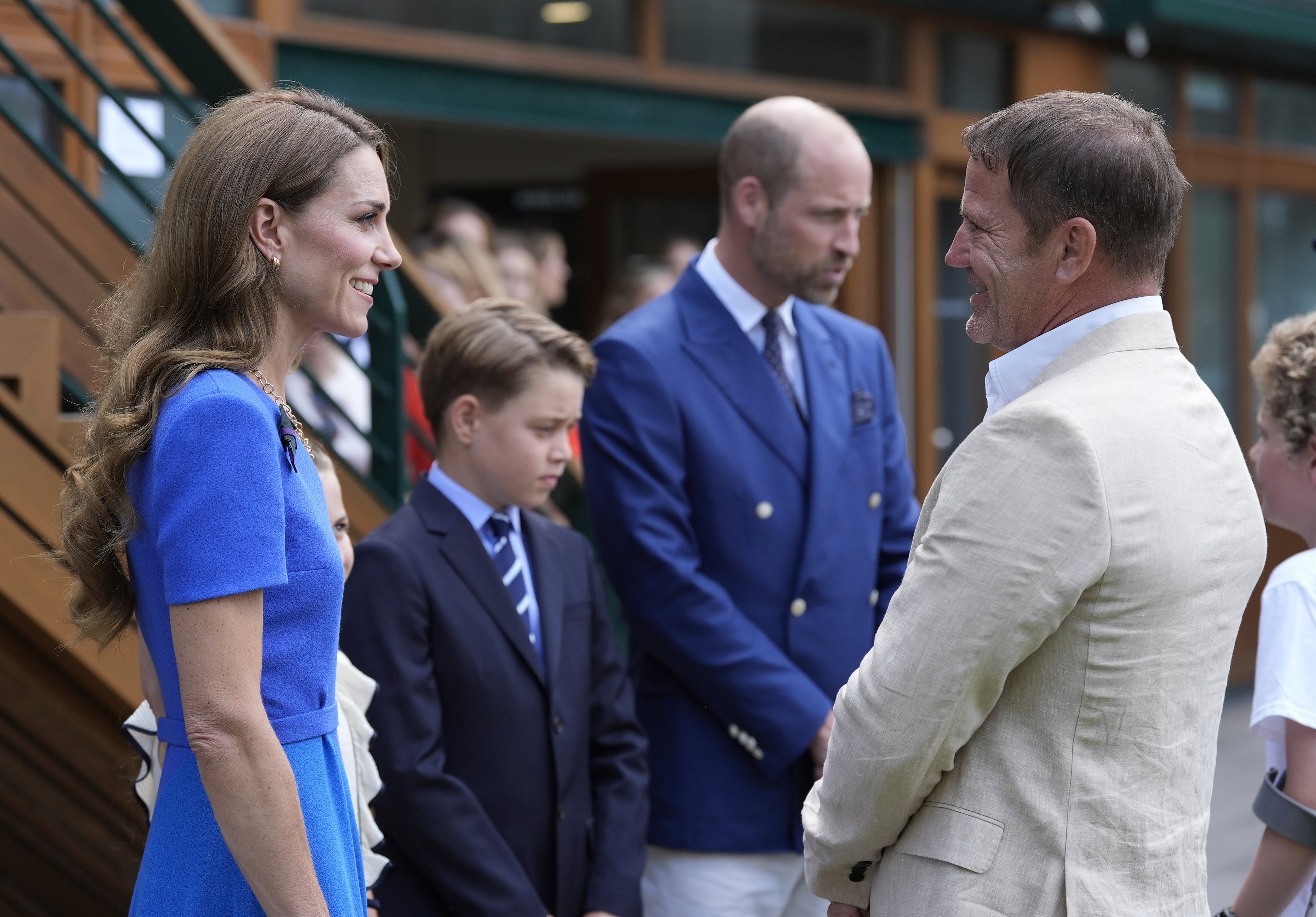 Britain's Prince William, second right, Kate, Princess of Wales, and Prince George meet Steve Backshall as they arrive