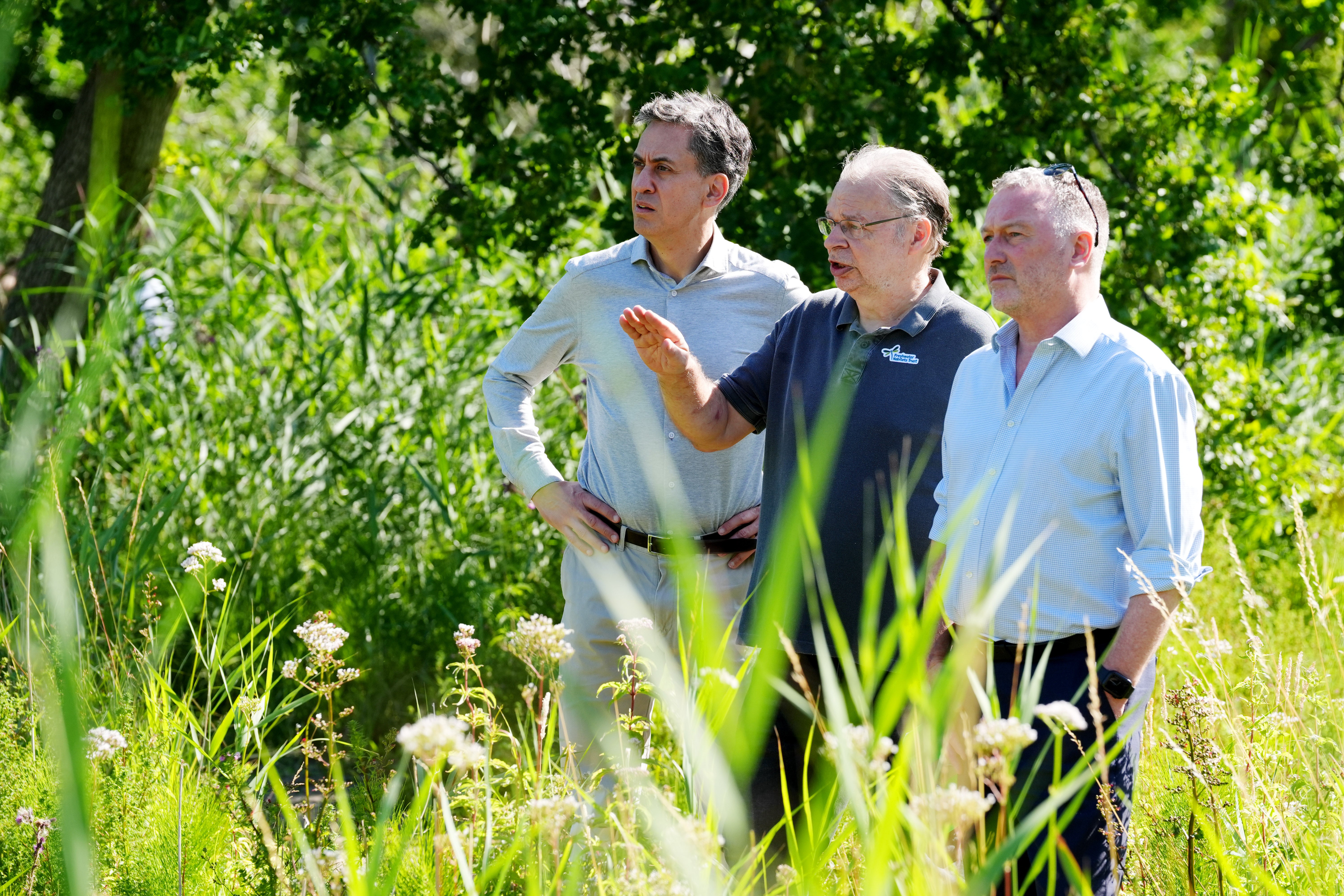 Environment secretary Steve Reed (right) and energy security and net zero secretary Ed Miliband (left) are joined by Jeremy Biggs of the Freshwater Habitats Trust during a visit to the Ock and Thame Farmers floodplain restoration project, in South Hinksey, Oxfordshire
