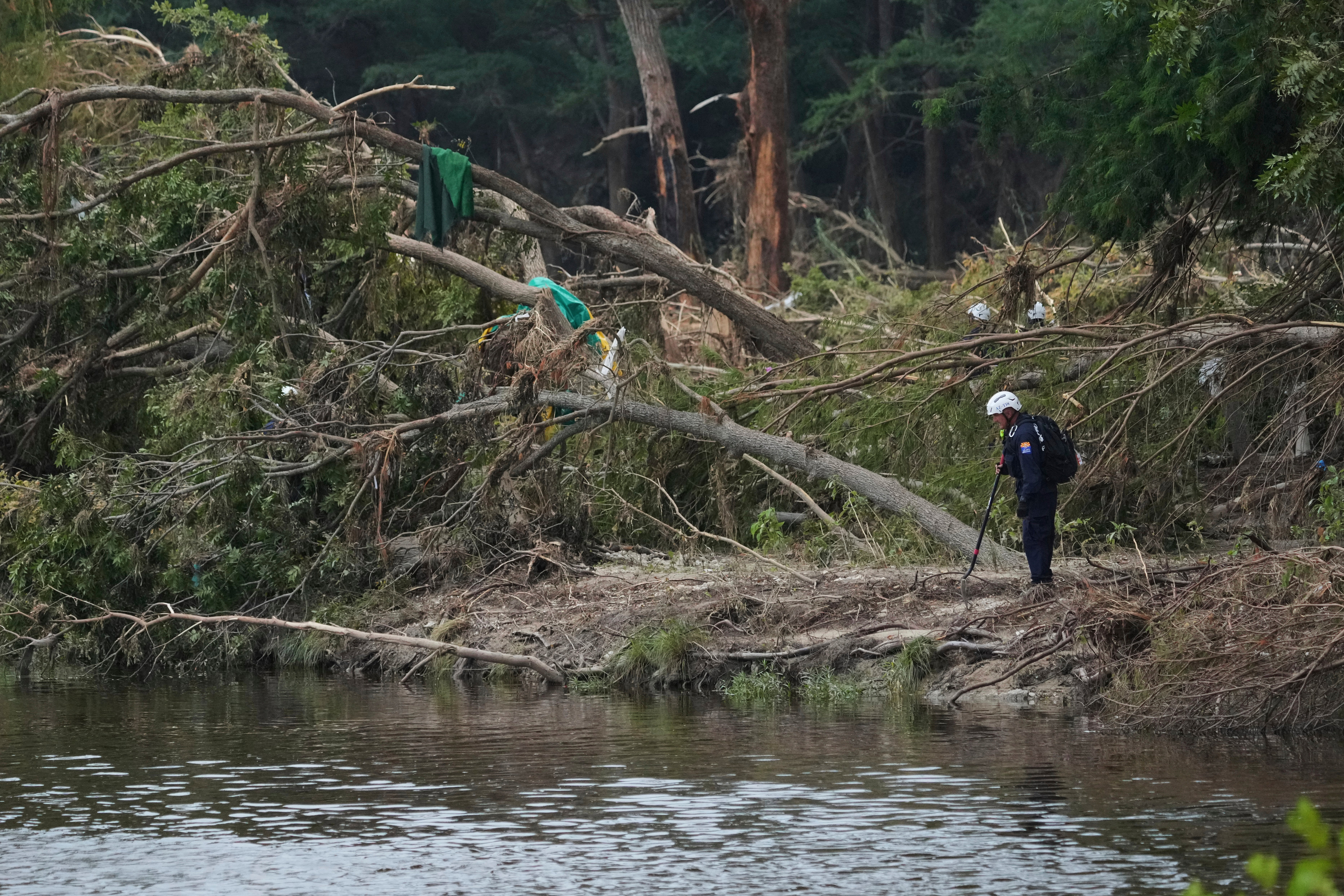 Search and rescue crews survey the Guadalupe River in the wake of the deadly floods on Independence Day