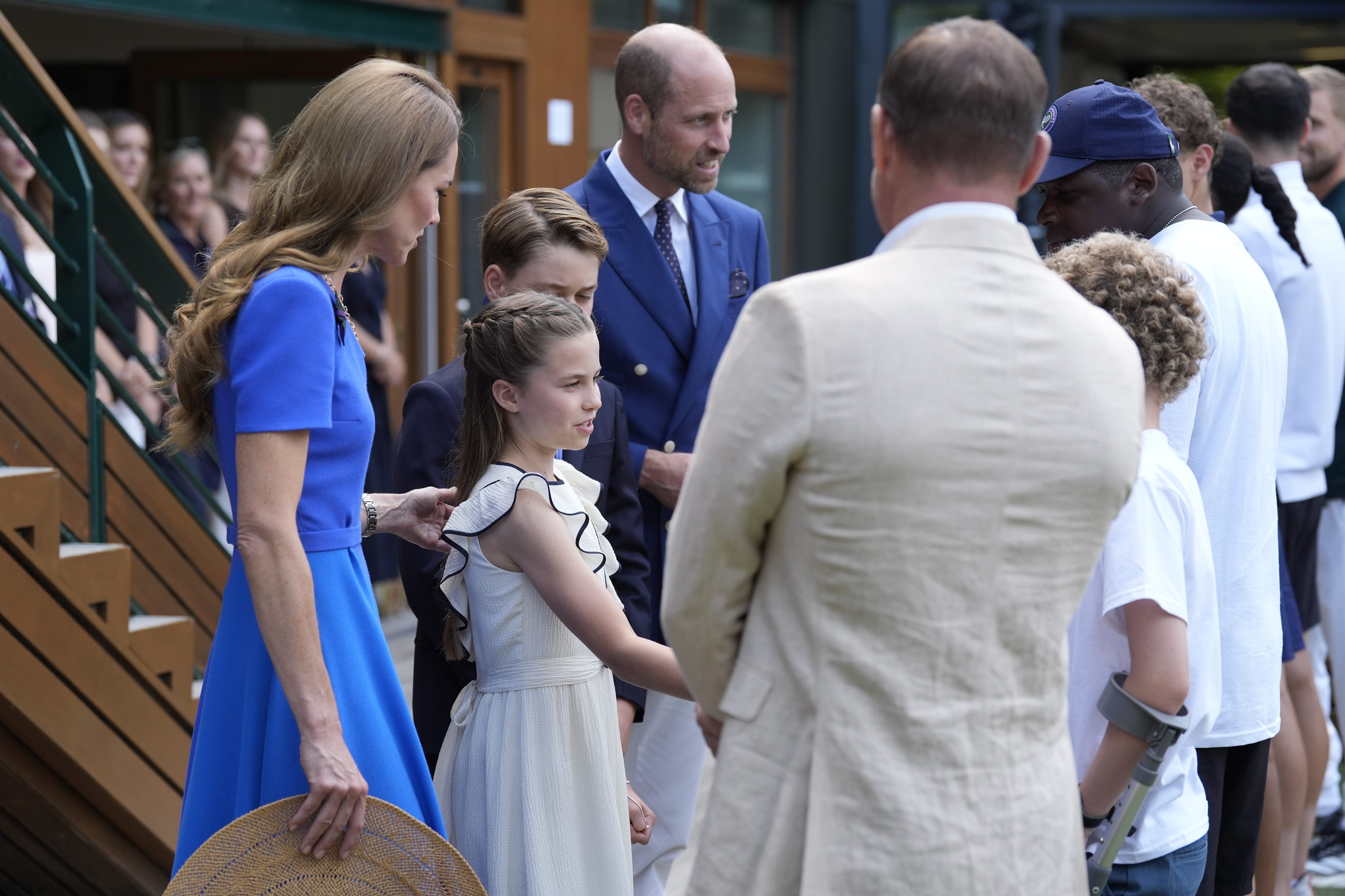 (Left to right) The Princess of Wales, Princess Charlotte, Prince George and the Prince of Wales meet Steve Backshall, on day fourteen of the 2025 Wimbledon Championships at the All England Lawn Tennis and Croquet Club, London (Andrew Matthews/PA)