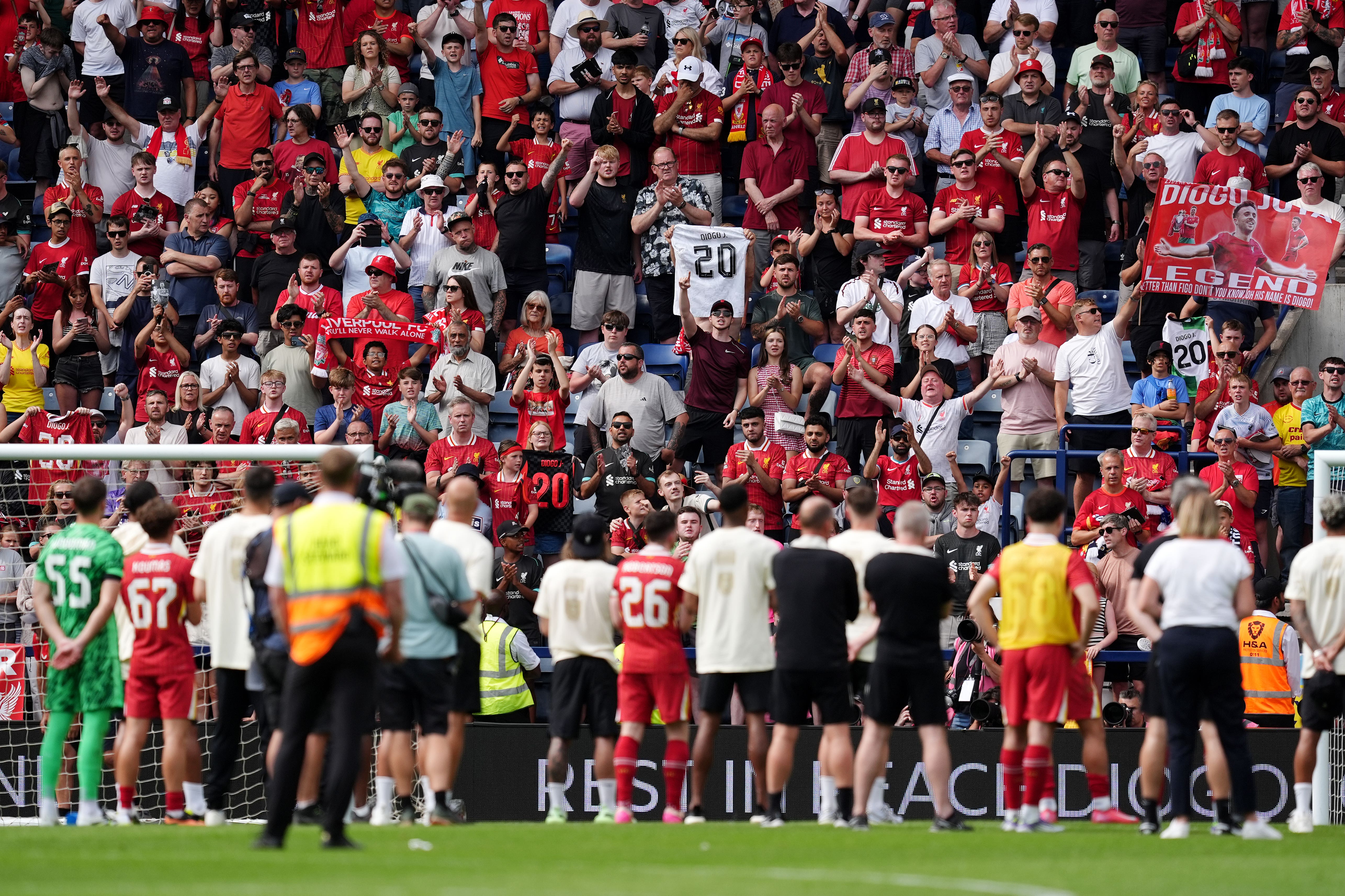 Liverpool fans pay tribute to Diogo Jota as the players watch on following the pre-season friendly at Preston