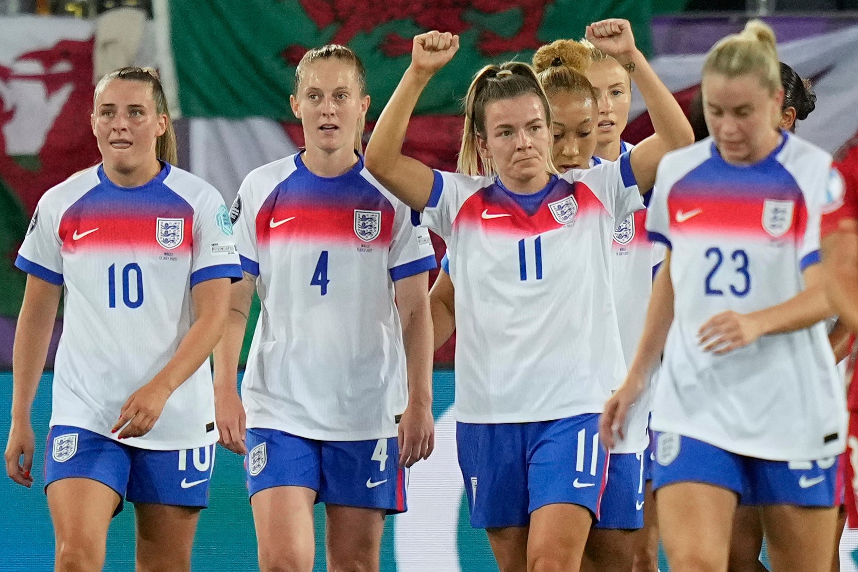 England's Lauren Hemp, center, celebrates with teammates