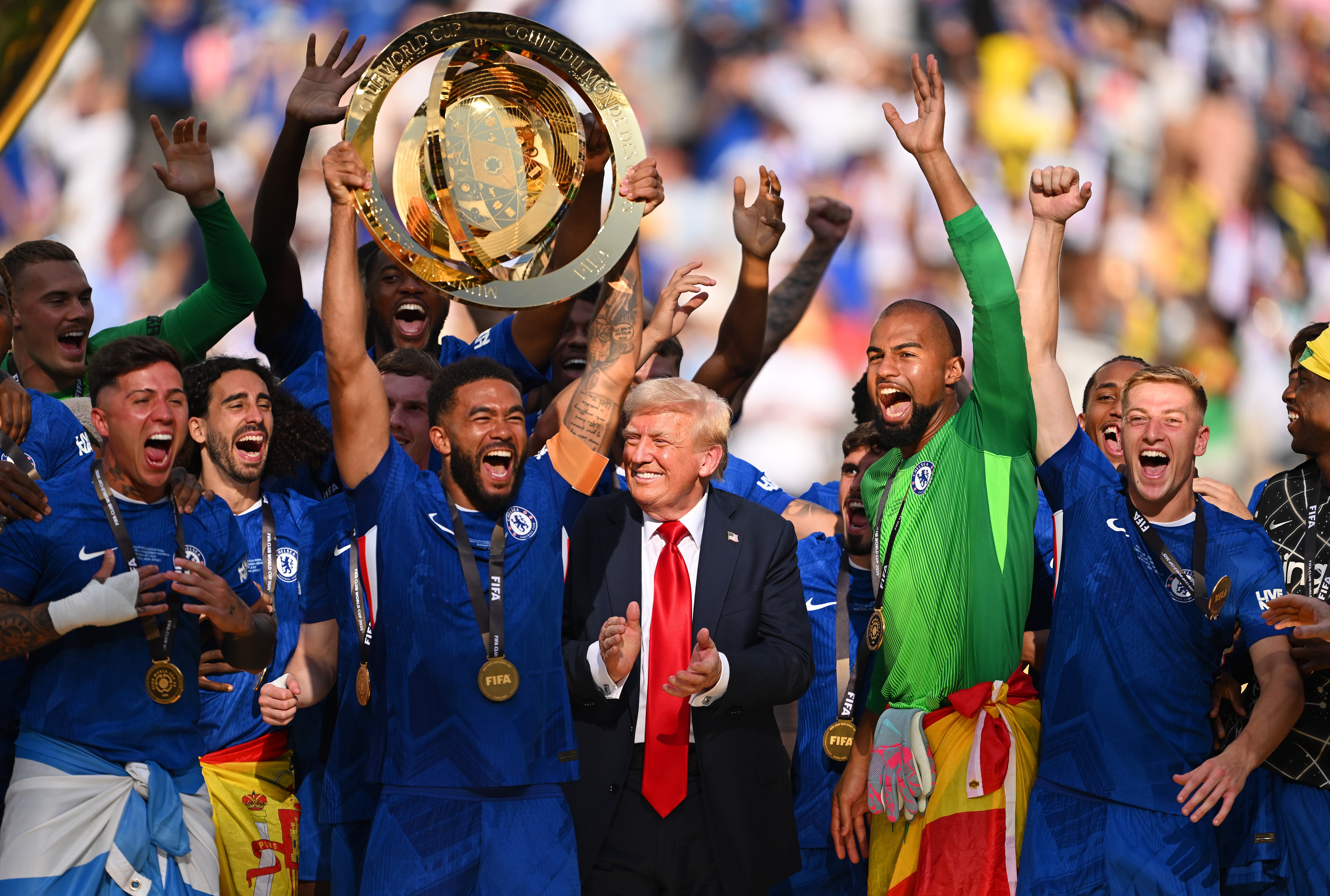 Reece James, beside Donald Trump, lifts the Club World Cup trophy