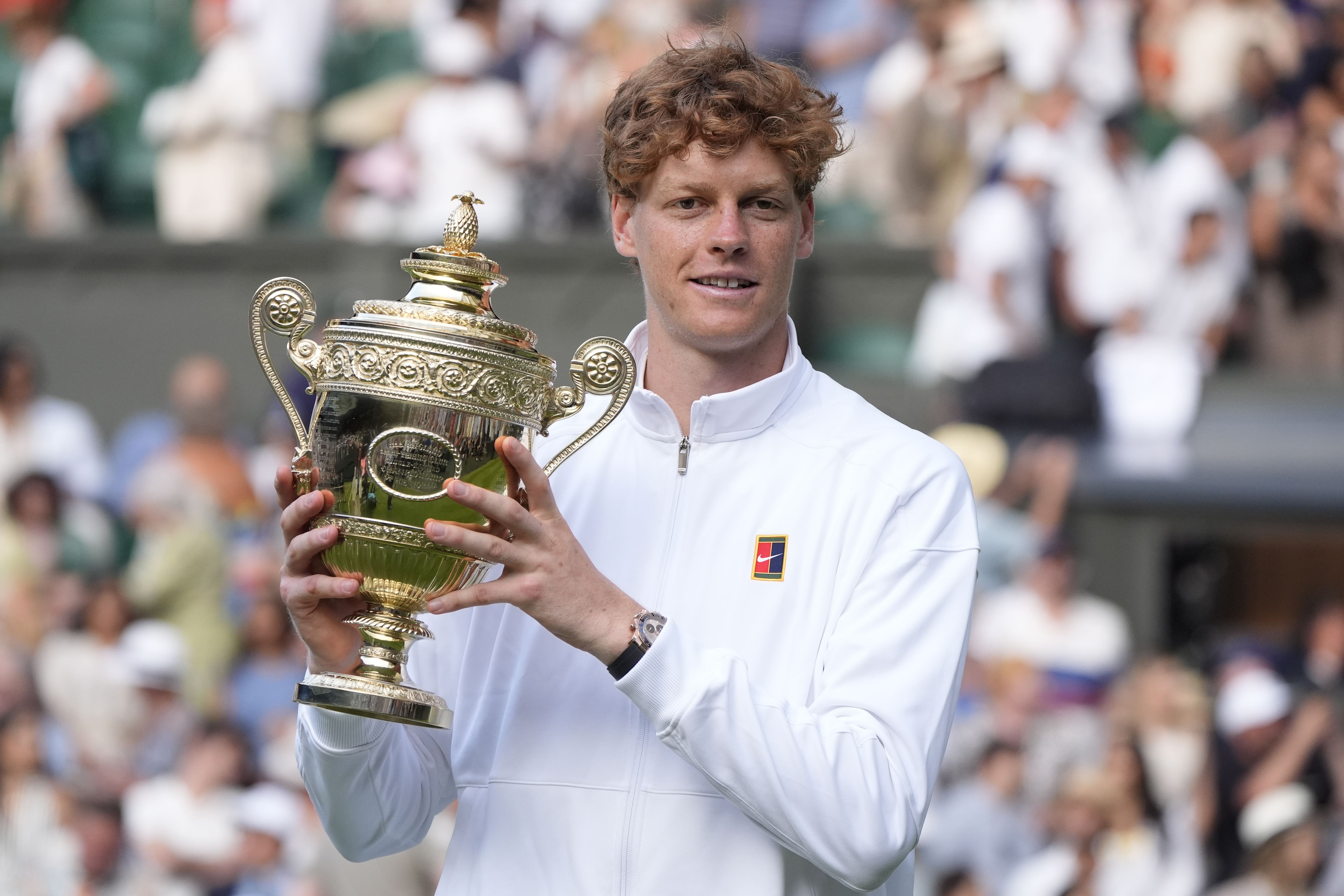 Jannik Sinner holds the Wimbledon trophy (Andrew Matthews/PA)