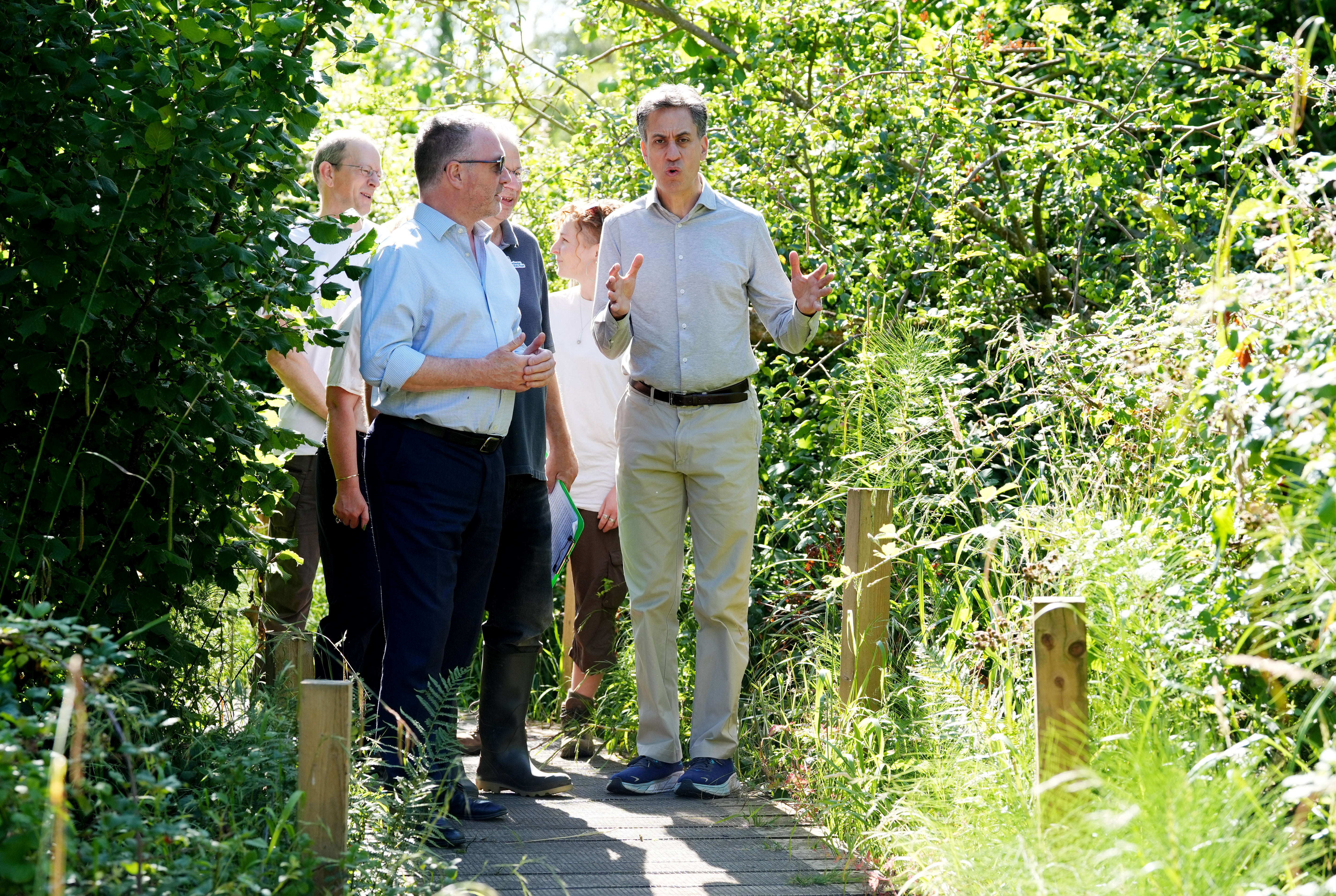 Energy Security and Net Zero Secretary Ed Miliband (right) and Environment Secretary Steve Reed (left) are joined by members of the Freshwater Habitats Trust during a visit to the Ock and Thame Farmers floodplain restoration project, in South Hinksey, Oxfordshire, ahead of the State of the Climate report. (Jonathan Brady/PA Wire)