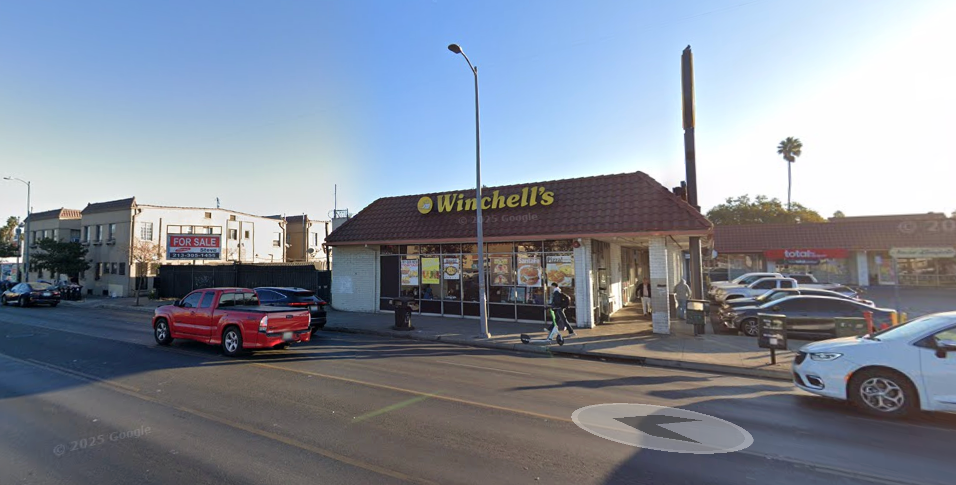 An armed man was captured on video storming a donut house (pictured) in Los Angeles, California