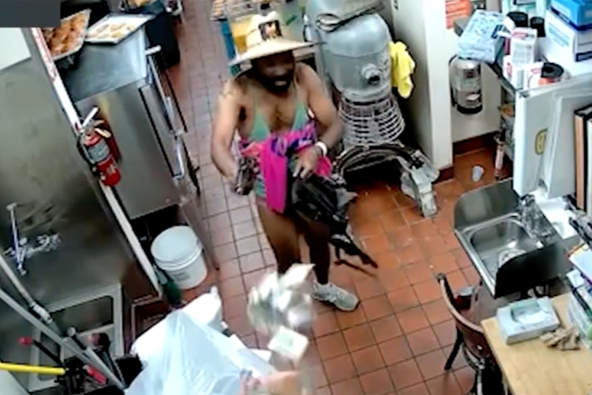 An armed man dressed in a bikini was captured on video attempting to rob a Los Angeles donut shop