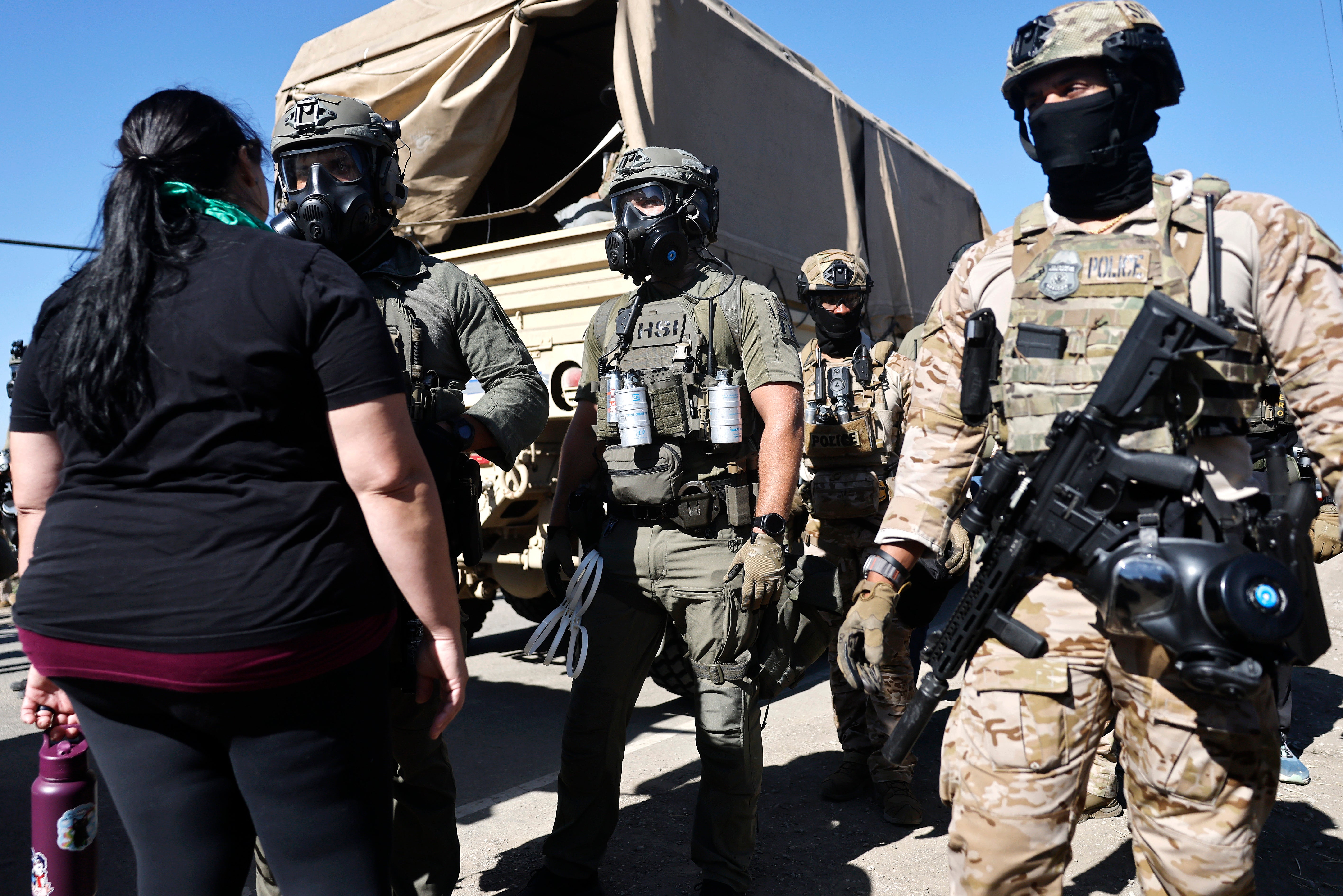 Masked federal agents descended on protesters outside a cannabis farm in California where more than 300 people were arrested during an ICE raid on July 10