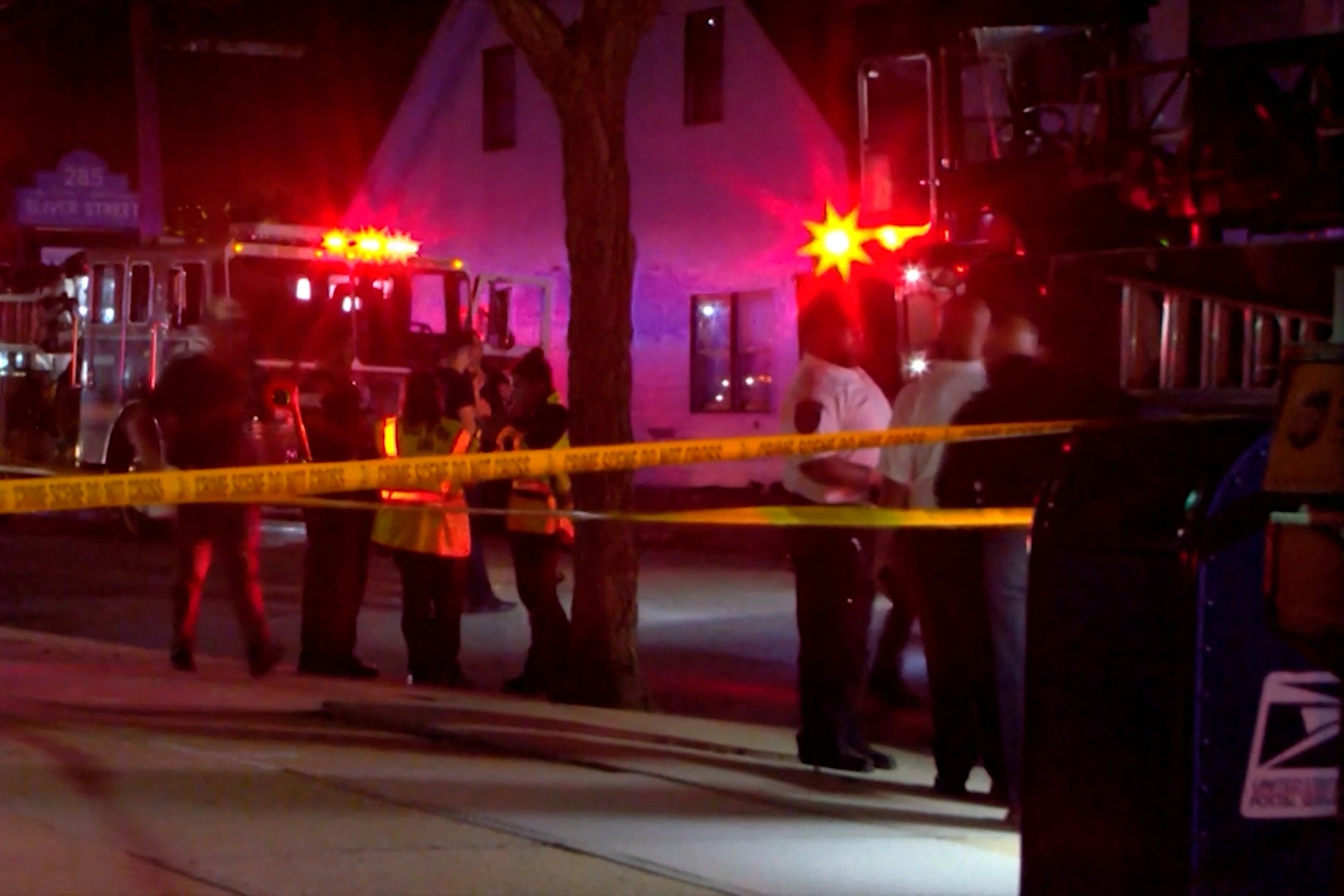 First responders gather at the Gabriel House Assisted Living Facility on Sunday night shortly after the flames broke out. At least 30 people, including five firefighters, were injured