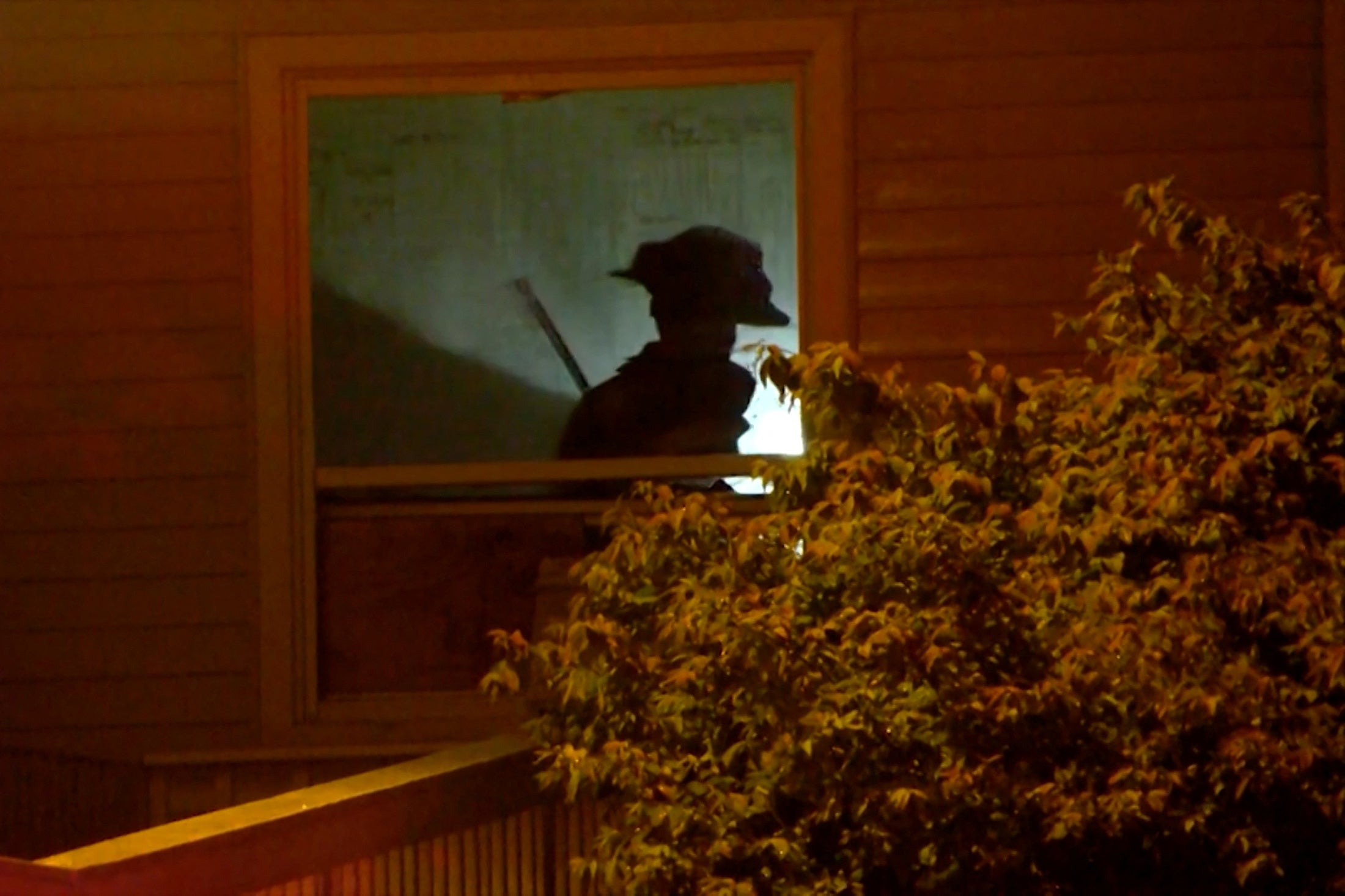 A firefighter’s shadow can be seen on a wall inside the facility as an extensive rescue operation took place. The cause of the fire is nder investigation.