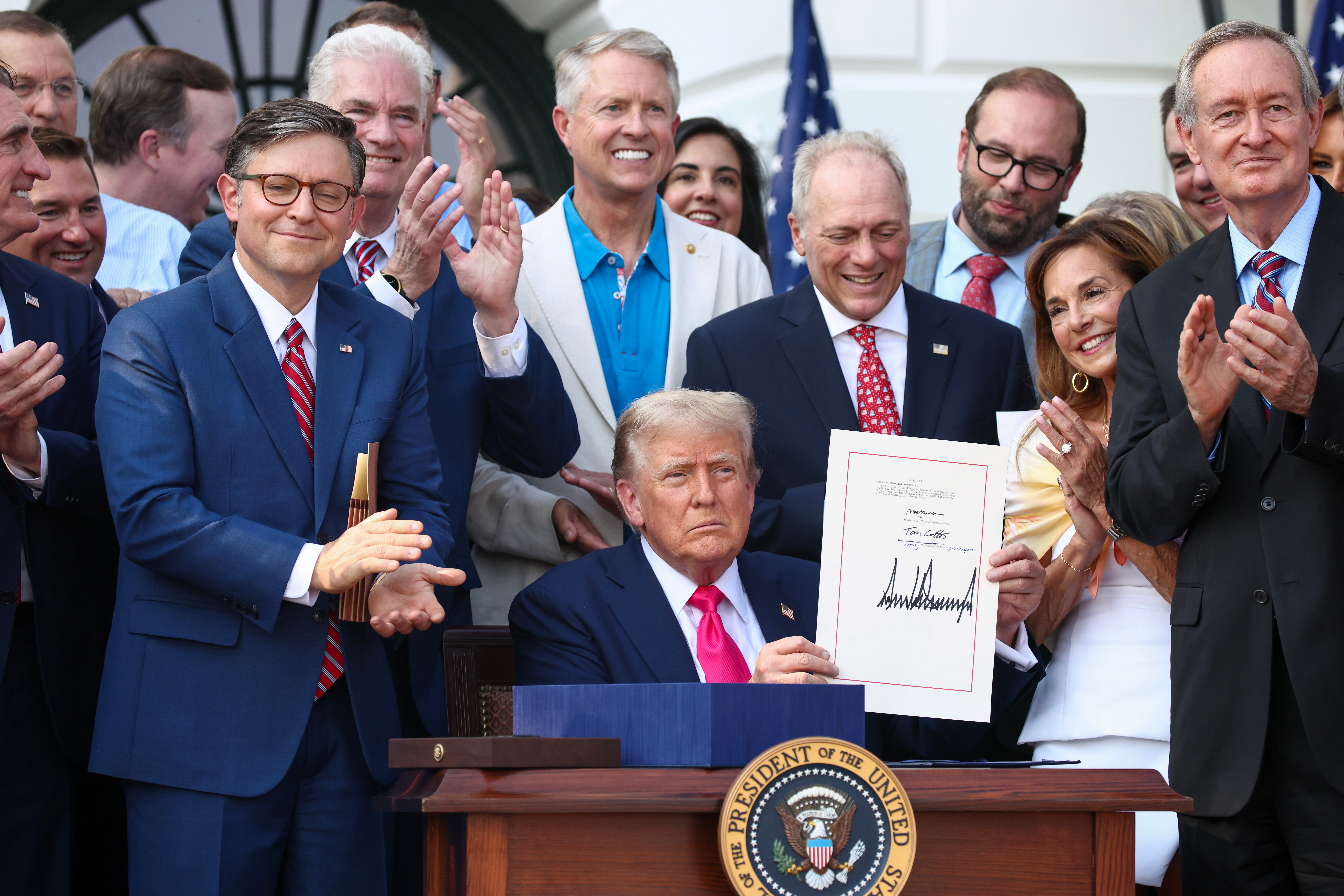 President Donald Trump signs his ‘One Big Beautiful Bill Act’ into law at an Independence Day celebration at the White House
