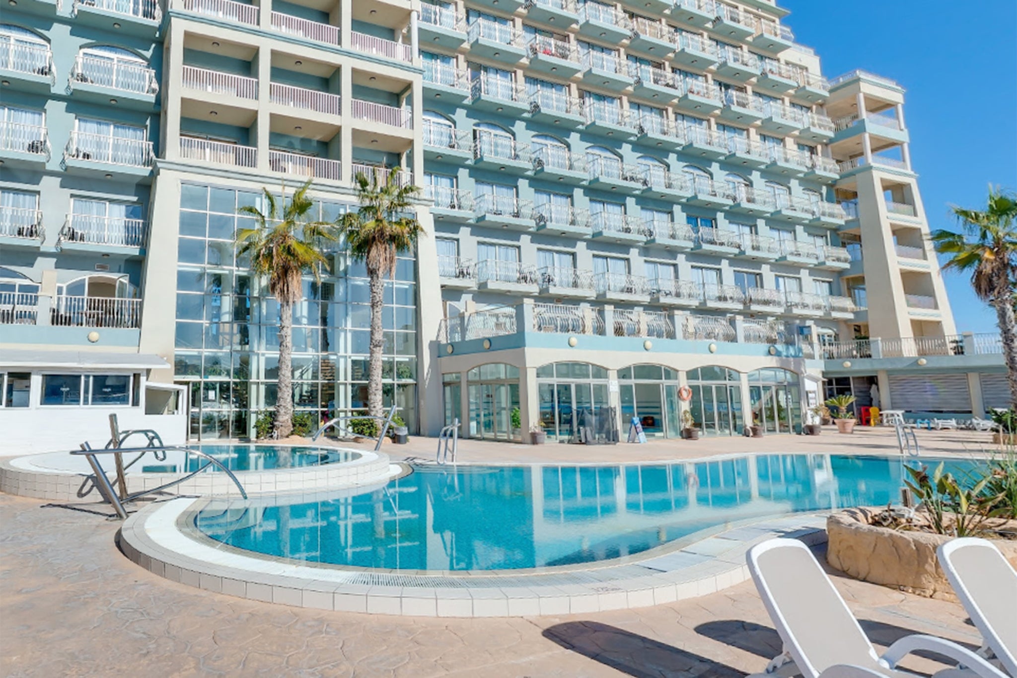 The Cavalieri Art Hotel in St Julian’s, where Mr Hughes fell to his death