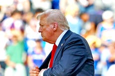 Trump seen pocketing FIFA medal as he walks on stage to hand Chelsea replica club championship trophy