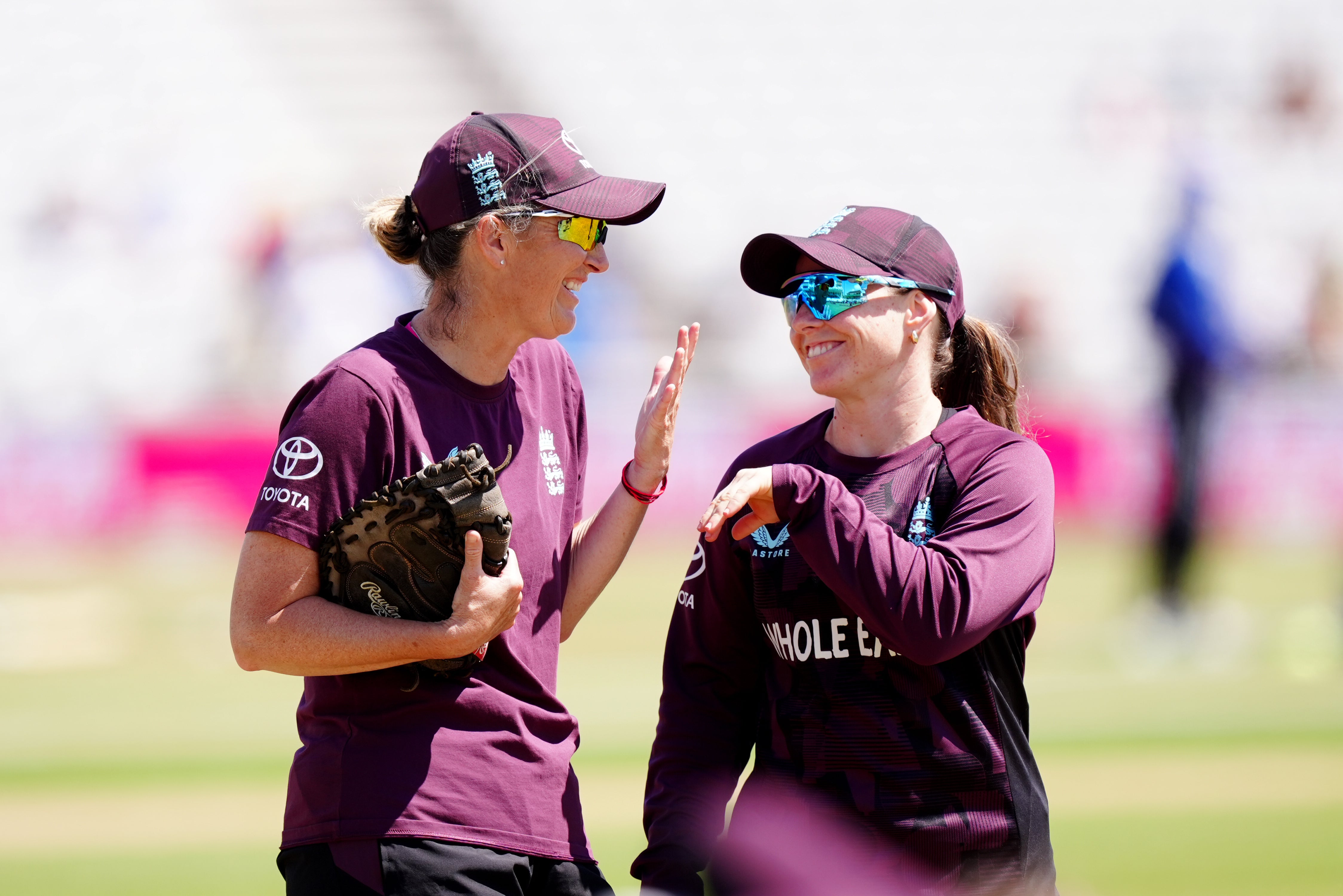 England coach Charlotte Edwards, left, and opening batter Tammy Beaumont share a joke (Mike Egerton/PA)