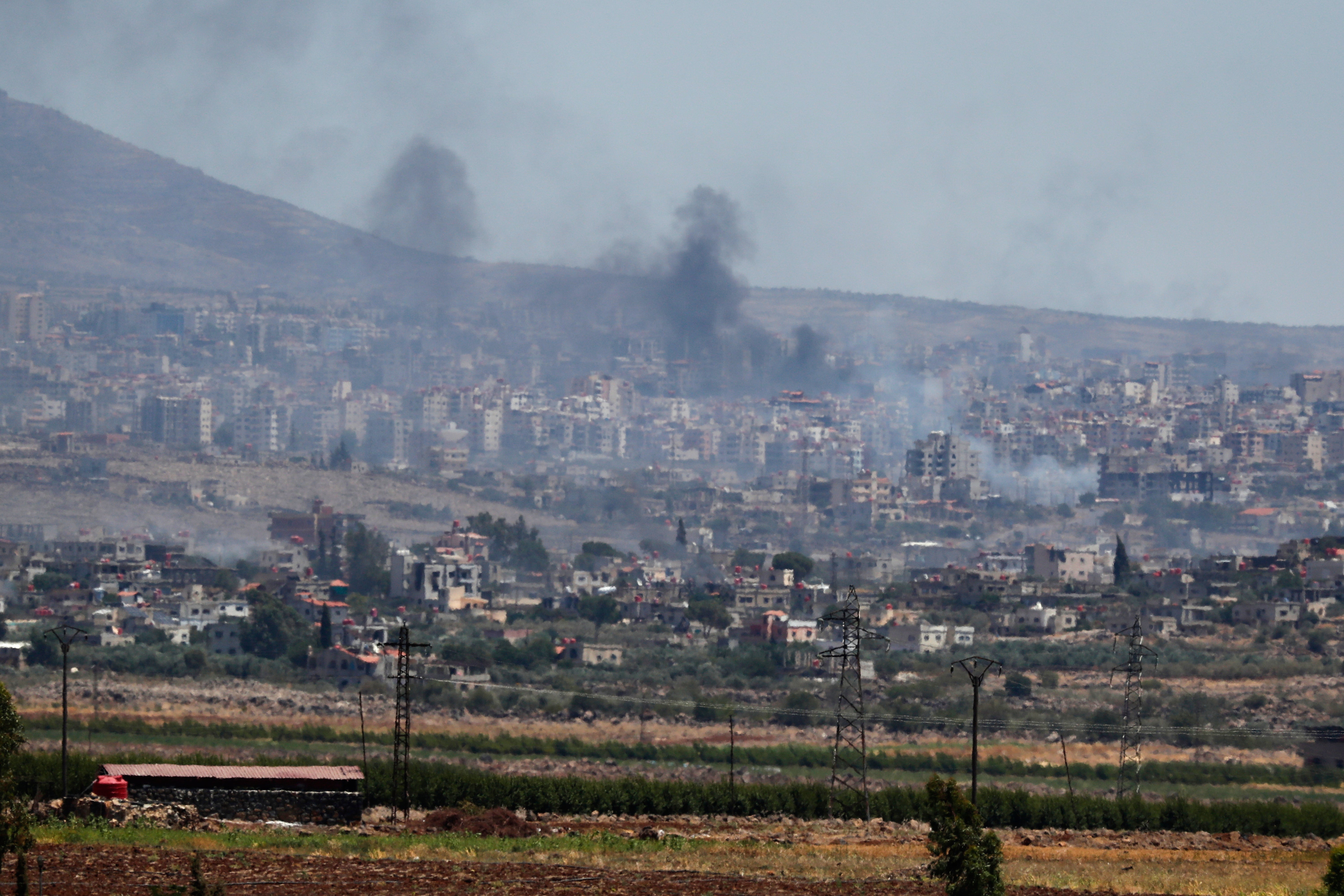 Smoke rises from clashes between Syrian government forces and Druze militias in Sweida earlier this week